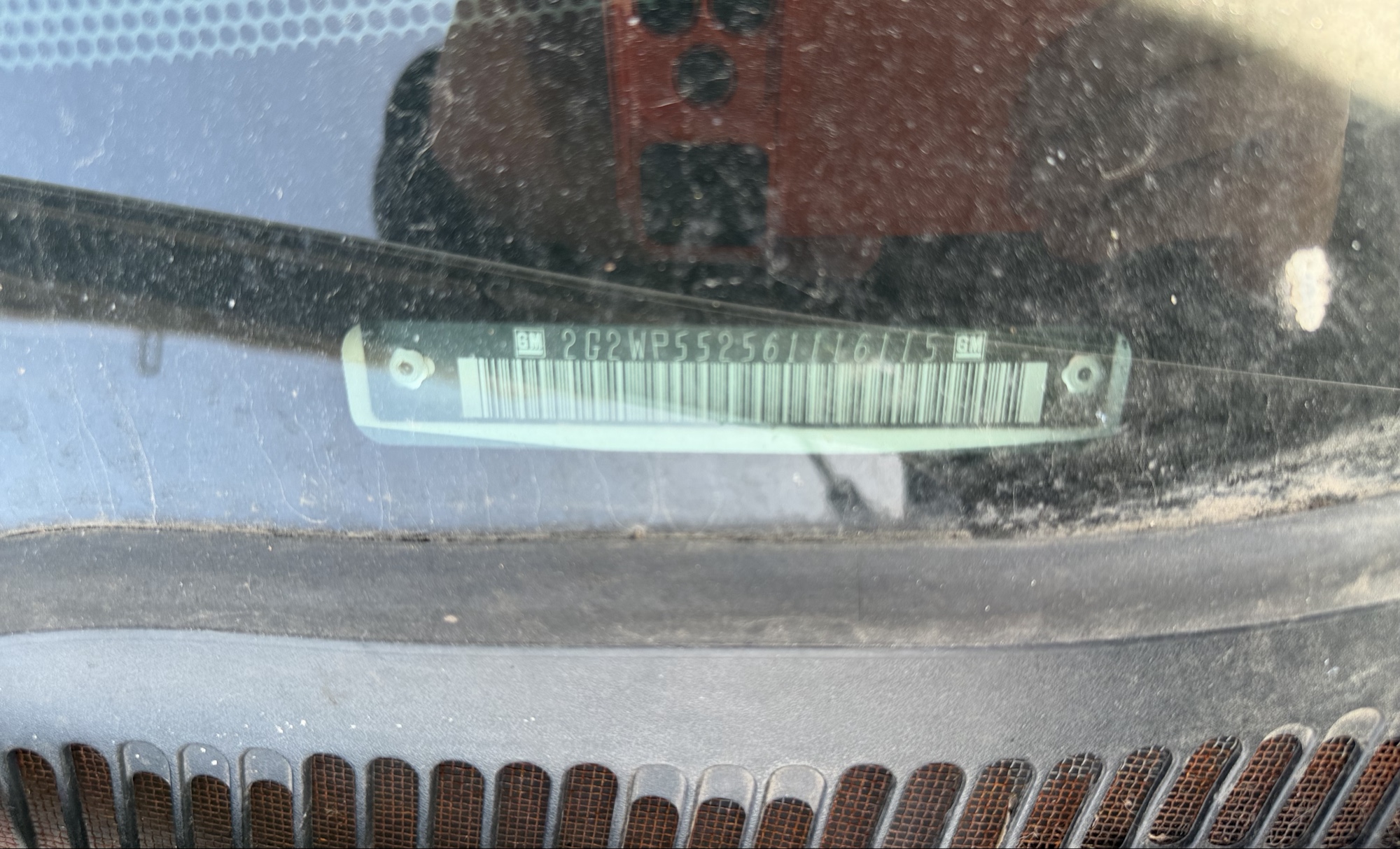 2006 pontiac grand-prix base with 237218 miles for sale near elk-river, minnesota 106150_48_windshield_vin_plate.jpg