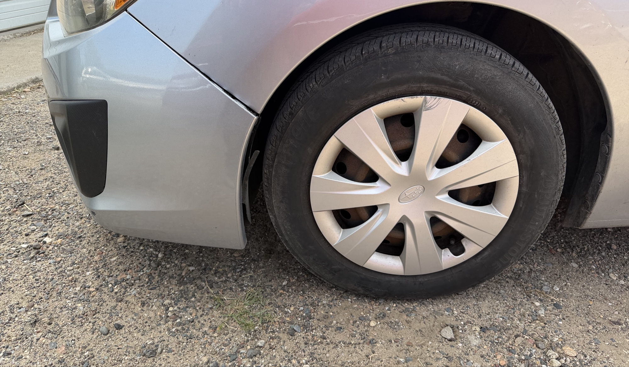 2013 subaru impreza base-5-door with 166153 miles for sale near elk-river, minnesota 106296_12_drv_front_wheel.jpg