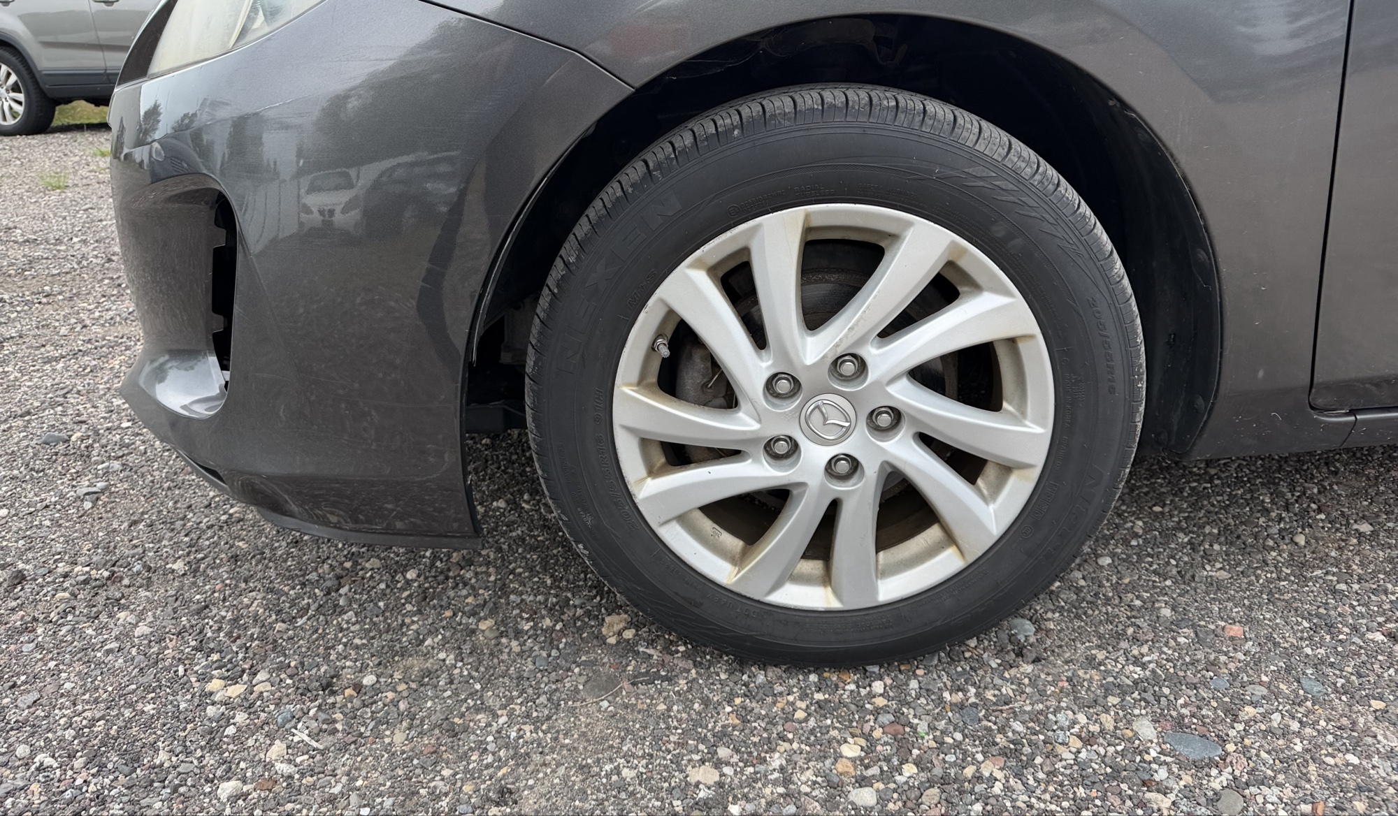 2012 mazda mazda3 i-touring-4-door with 105844 miles for sale near elk-river, minnesota 106316_12_drv_front_wheel.jpg
