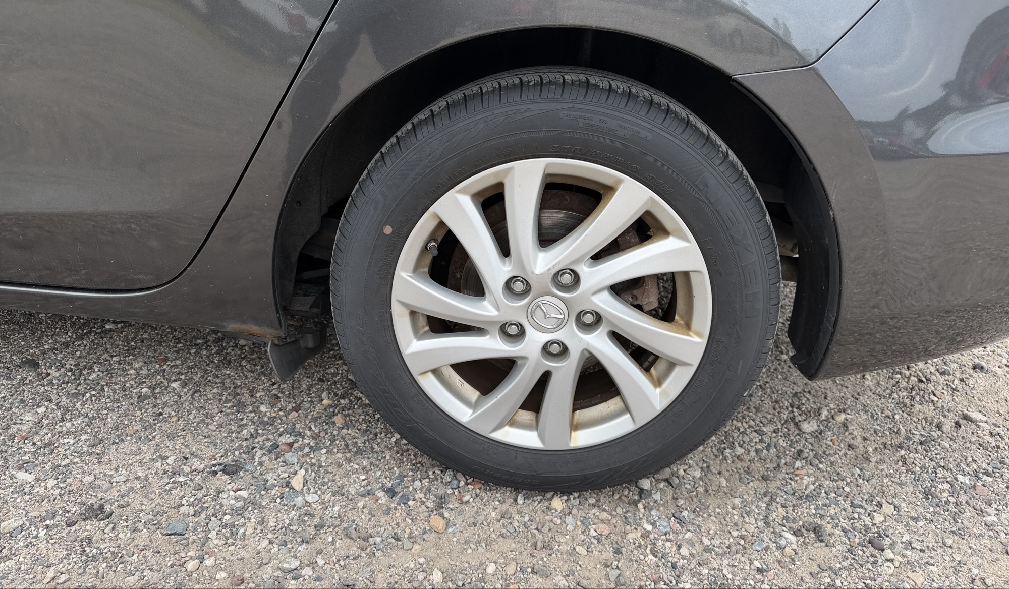 2012 mazda mazda3 i-touring-4-door with 105844 miles for sale near elk-river, minnesota 106316_13_rear_drv_wheel.jpg