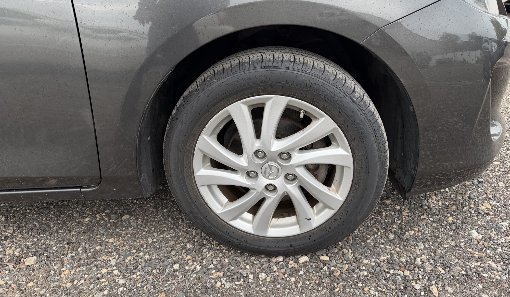 2012 mazda mazda3 i-touring-4-door with 105844 miles for sale near elk-river, minnesota 106316_15_front_pass_wheel.jpg