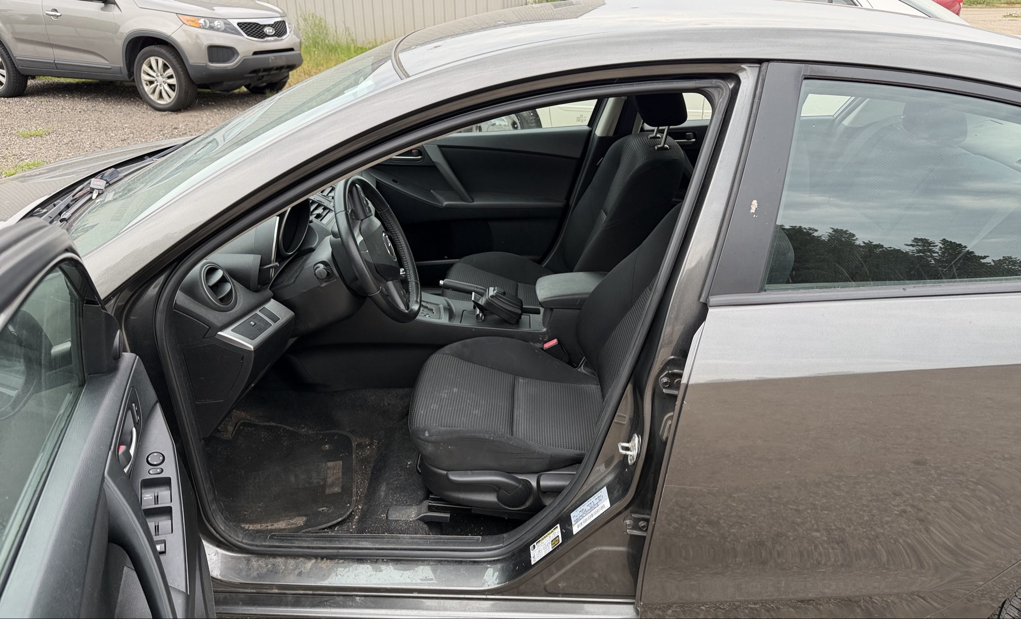 2012 mazda mazda3 i-touring-4-door with 105844 miles for sale near elk-river, minnesota 106316_22_driver_seat.jpg