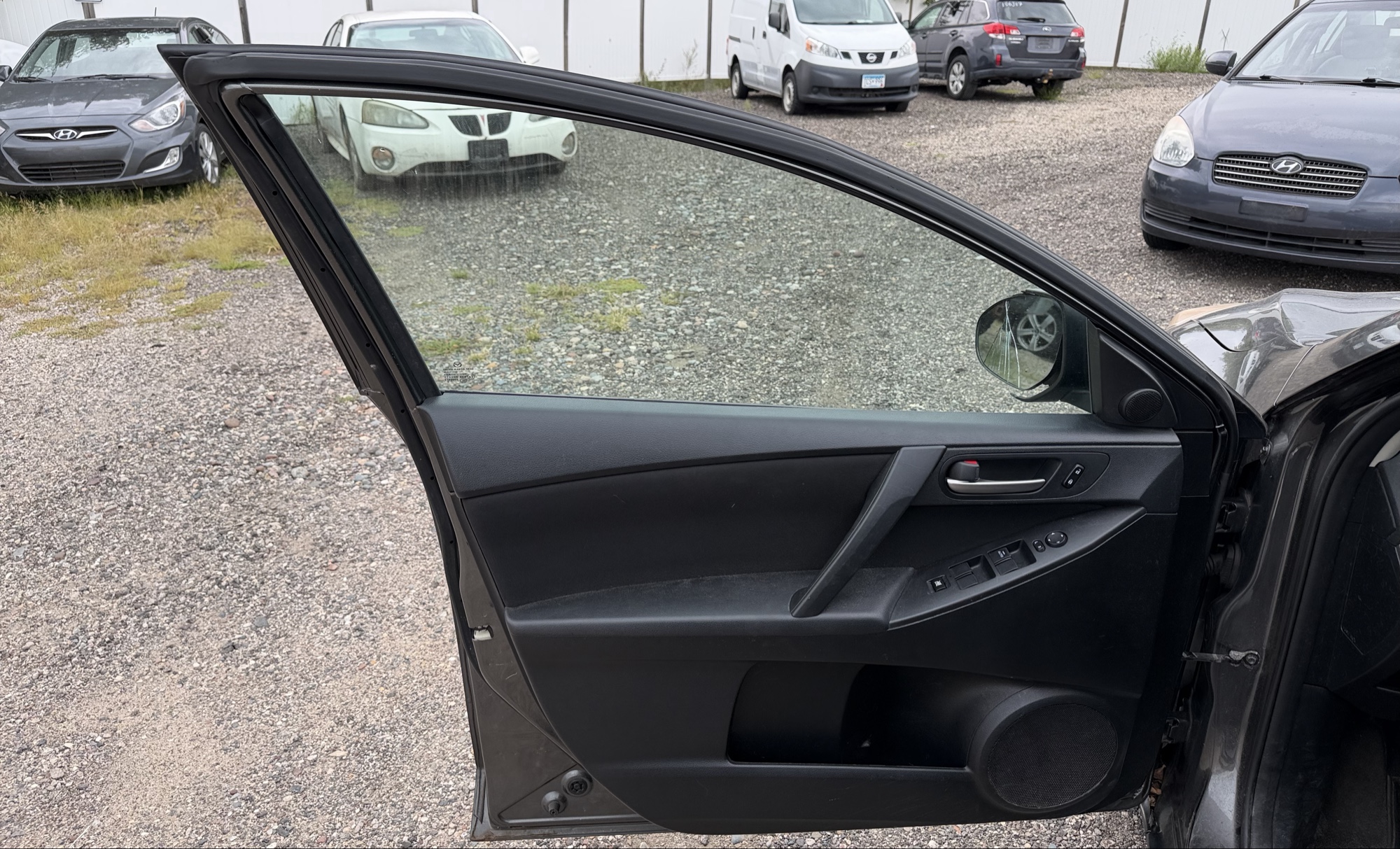 2012 mazda mazda3 i-touring-4-door with 105844 miles for sale near elk-river, minnesota 106316_23_driver_door_panel.jpg