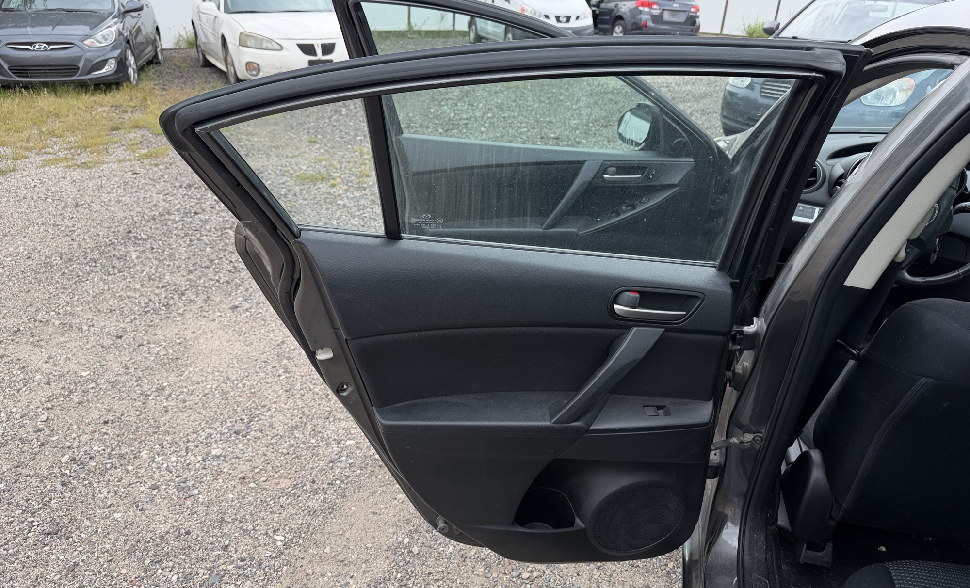 2012 mazda mazda3 i-touring-4-door with 105844 miles for sale near elk-river, minnesota 106316_25_drv_rear_door_panel.jpg