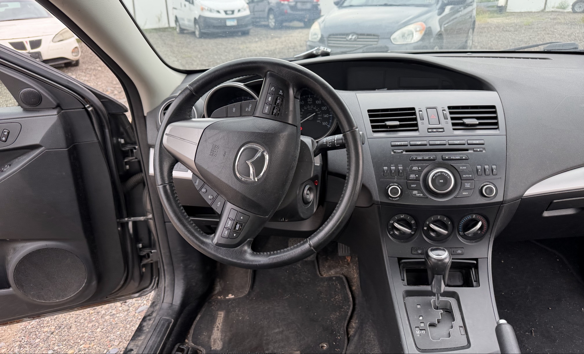 2012 mazda mazda3 i-touring-4-door with 105844 miles for sale near elk-river, minnesota 106316_33_dash_from_driver.jpg
