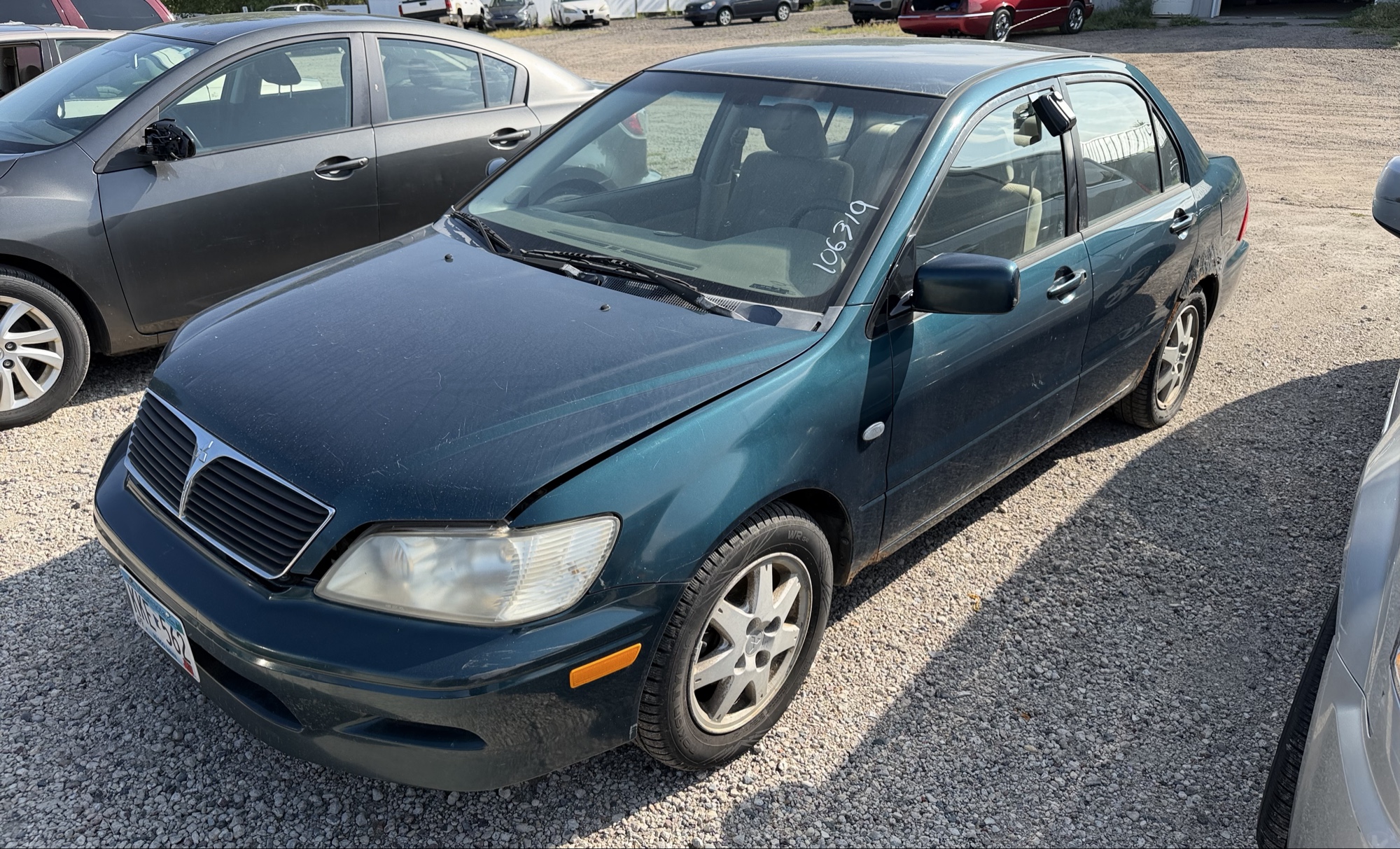 2002 mitsubishi lancer base with 166691 miles for sale near elk-river, minnesota 106319_01_driver_front_corner.jpg