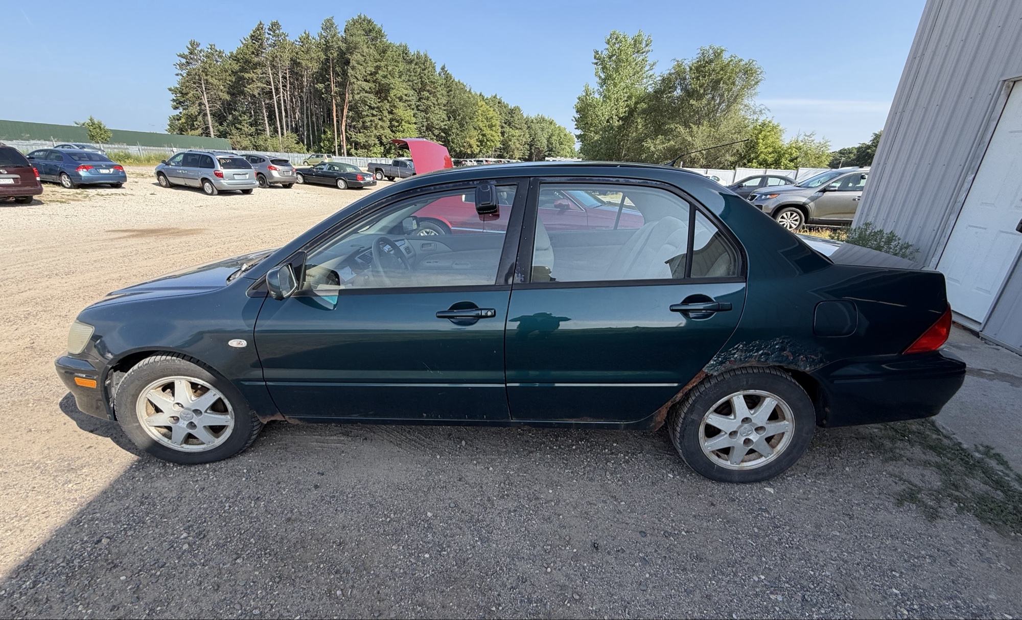 2002 mitsubishi lancer base with 166691 miles for sale near elk-river, minnesota 106319_02_driver_side.jpg