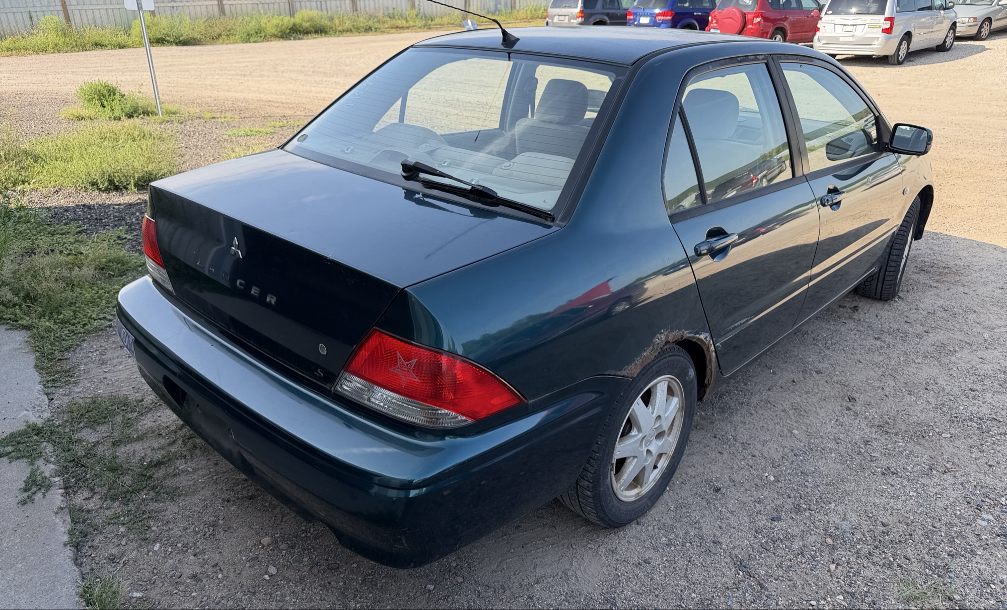 2002 mitsubishi lancer base with 166691 miles for sale near elk-river, minnesota 106319_05_pass_rear_corner.jpg