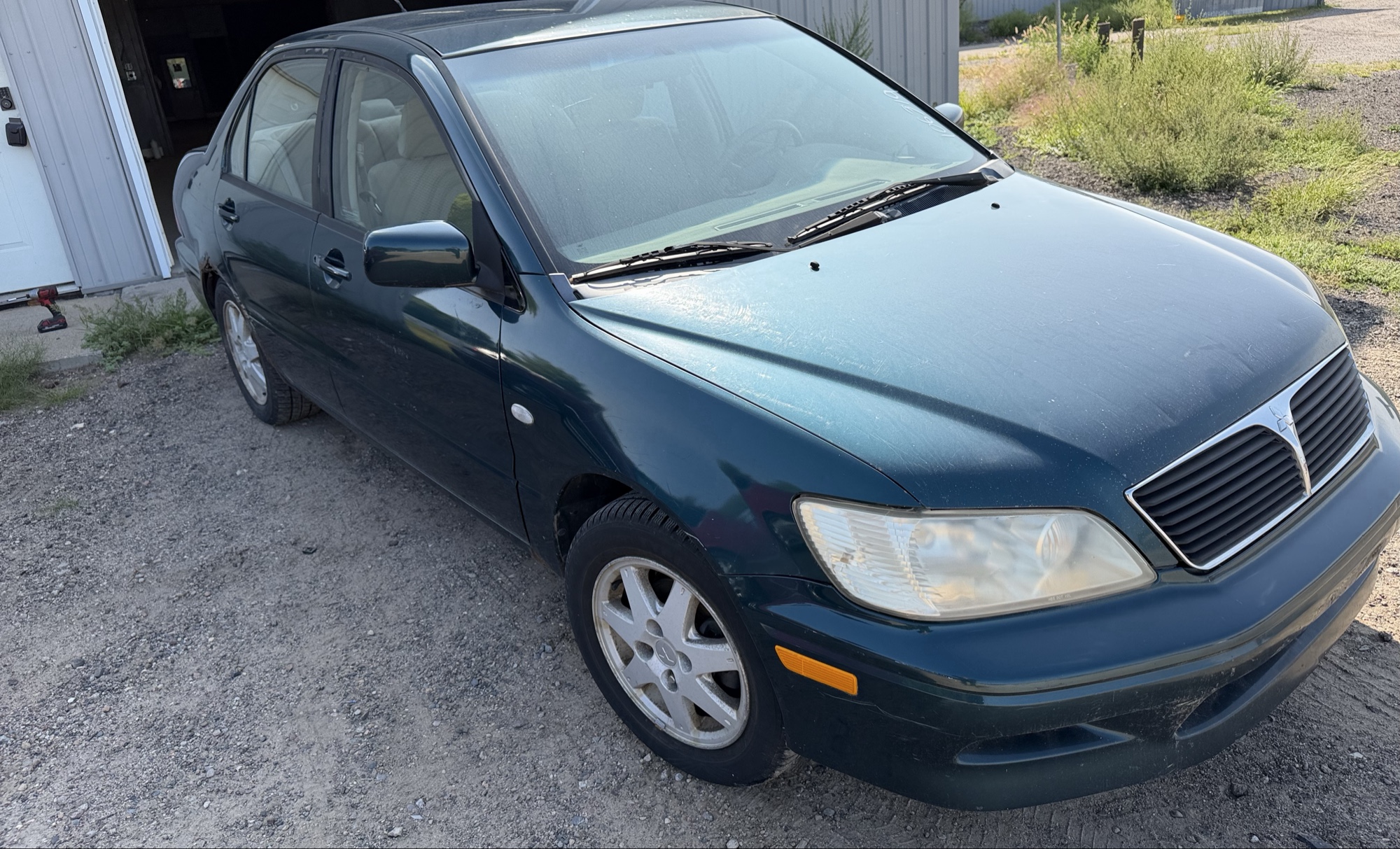 2002 mitsubishi lancer base with 166691 miles for sale near elk-river, minnesota 106319_07_pass_front_corner.jpg