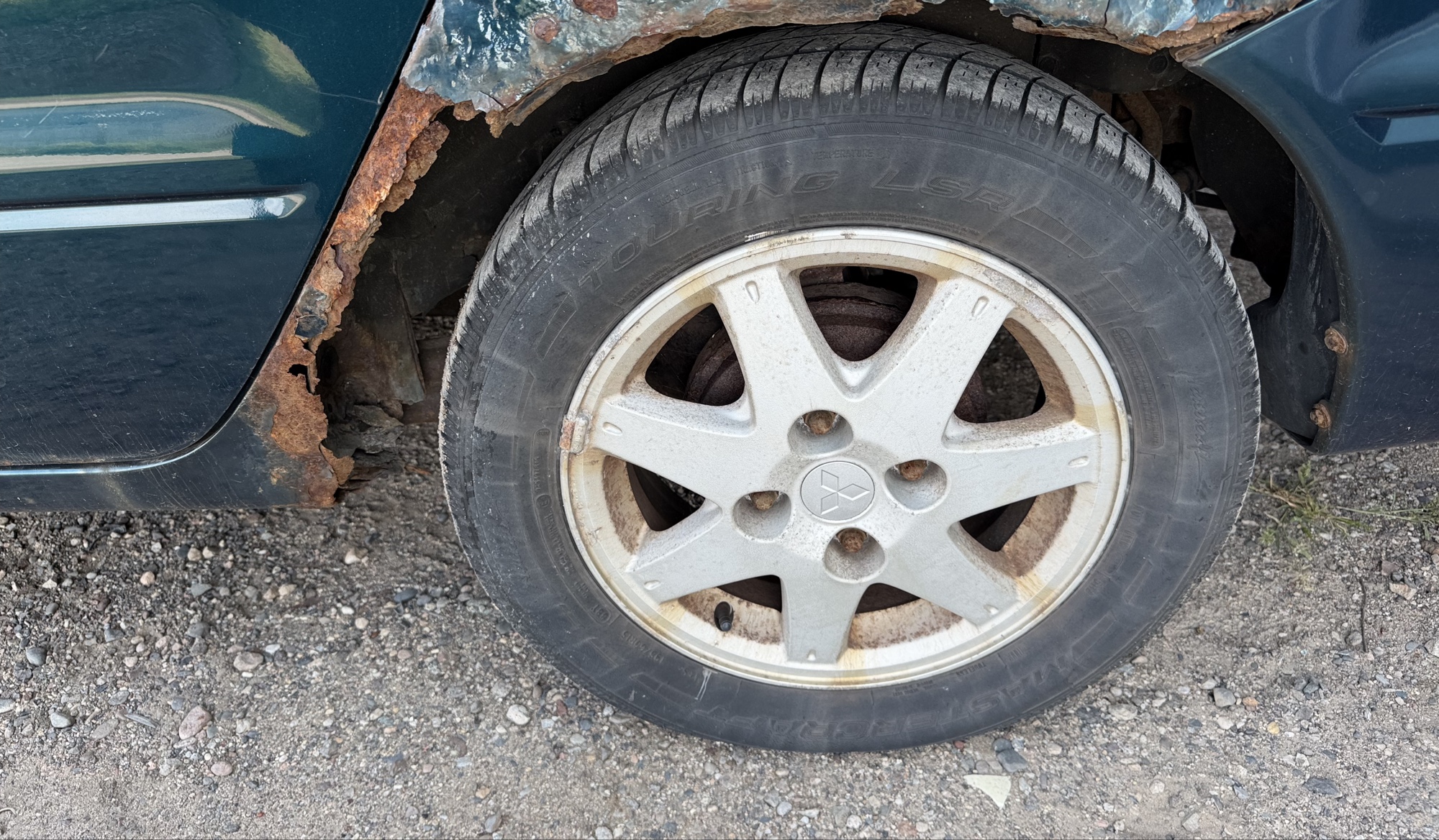 2002 mitsubishi lancer base with 166691 miles for sale near elk-river, minnesota 106319_13_rear_drv_wheel.jpg
