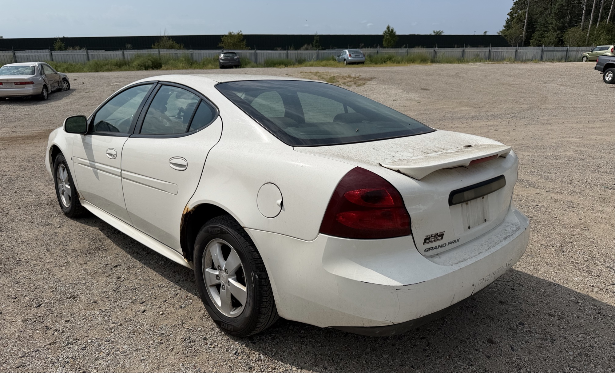 2008 pontiac grand-prix sedan with 118916 miles for sale near elk-river, minnesota 106356_03_rear_driver_corner.jpg