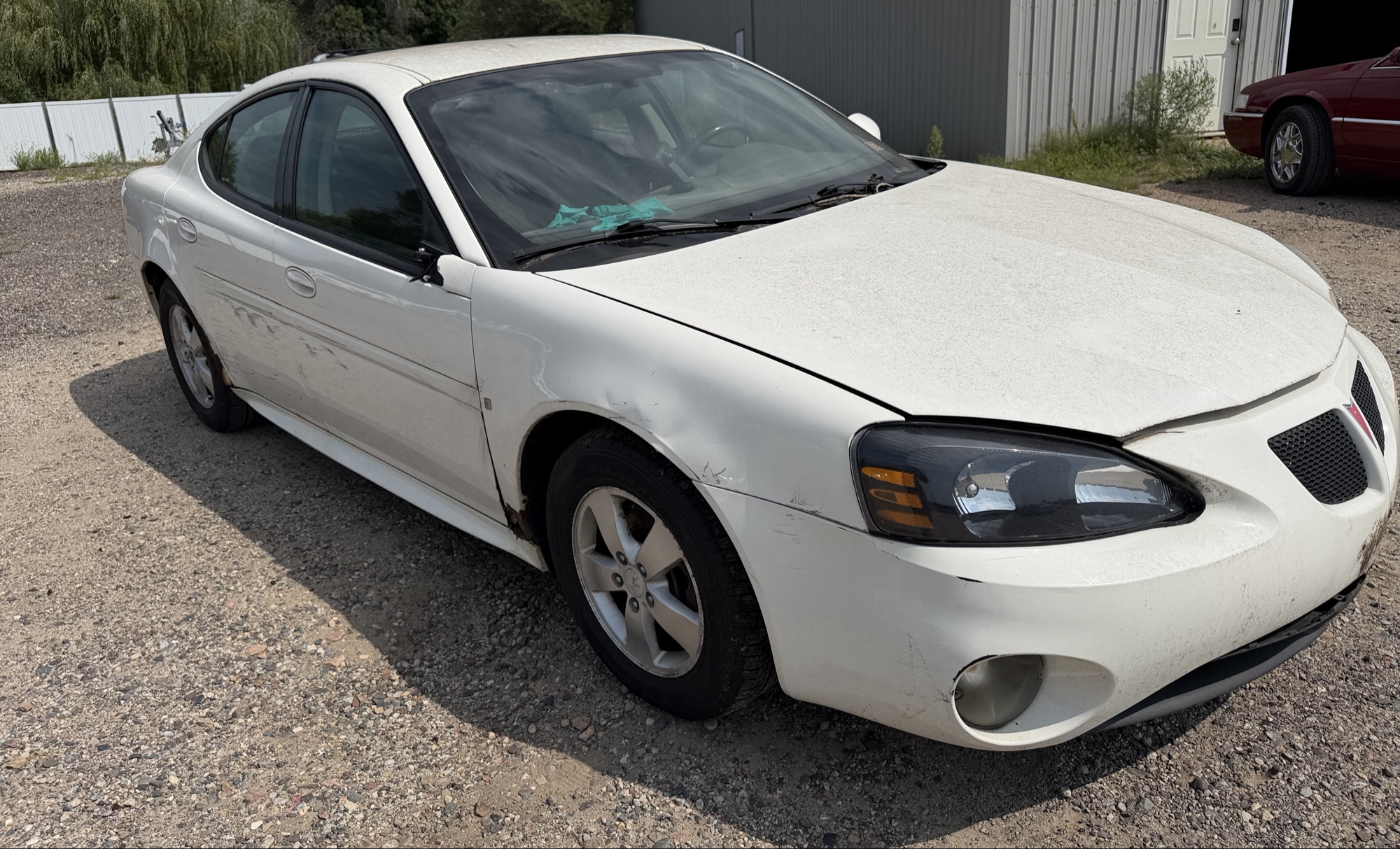 2008 pontiac grand-prix sedan with 118916 miles for sale near elk-river, minnesota 106356_07_pass_front_corner.jpg