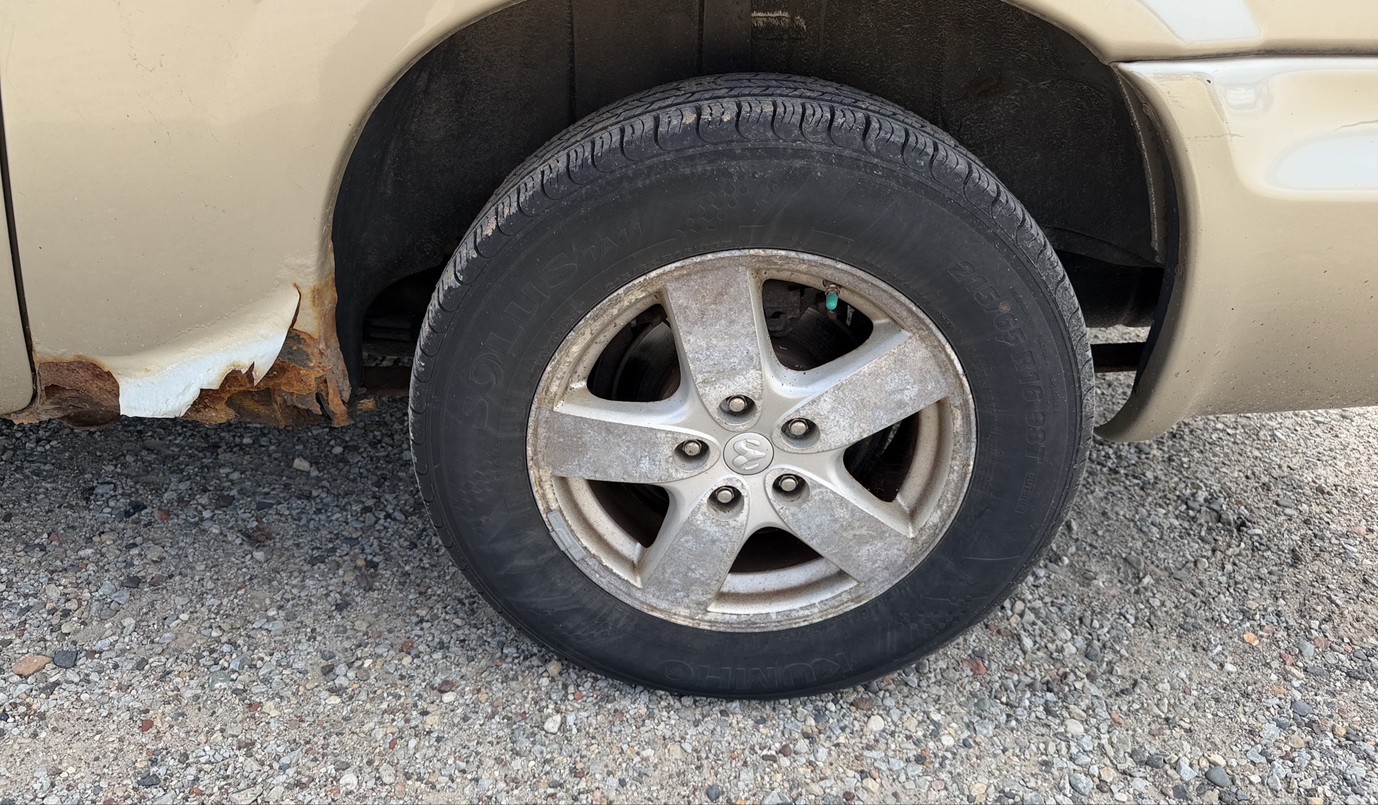 2007 dodge grand-caravan sxt with 141064 miles for sale near elk-river, minnesota 106358_13_rear_drv_wheel.jpg