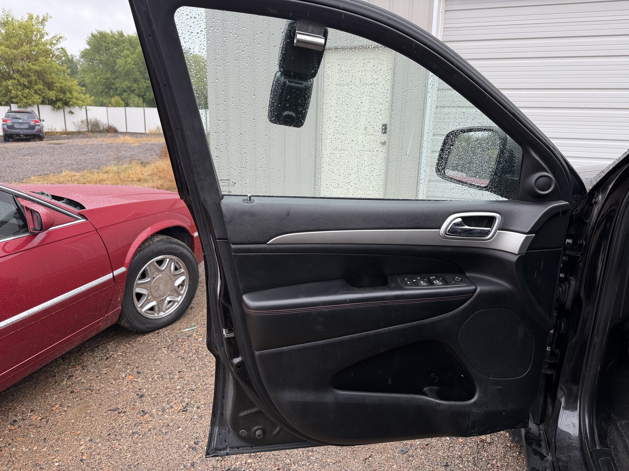 2013 jeep grand-cherokee laredo-4wd with 134157 miles for sale near elk-river, minnesota 106371_23_driver_door_panel.jpg