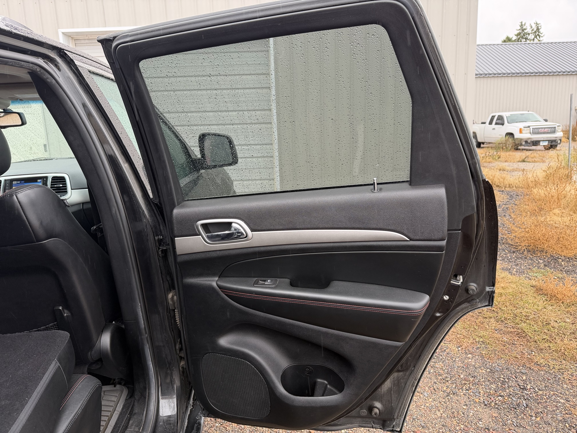 2013 jeep grand-cherokee laredo-4wd with 134157 miles for sale near elk-river, minnesota 106371_30_pass_rear_door_panel.jpg