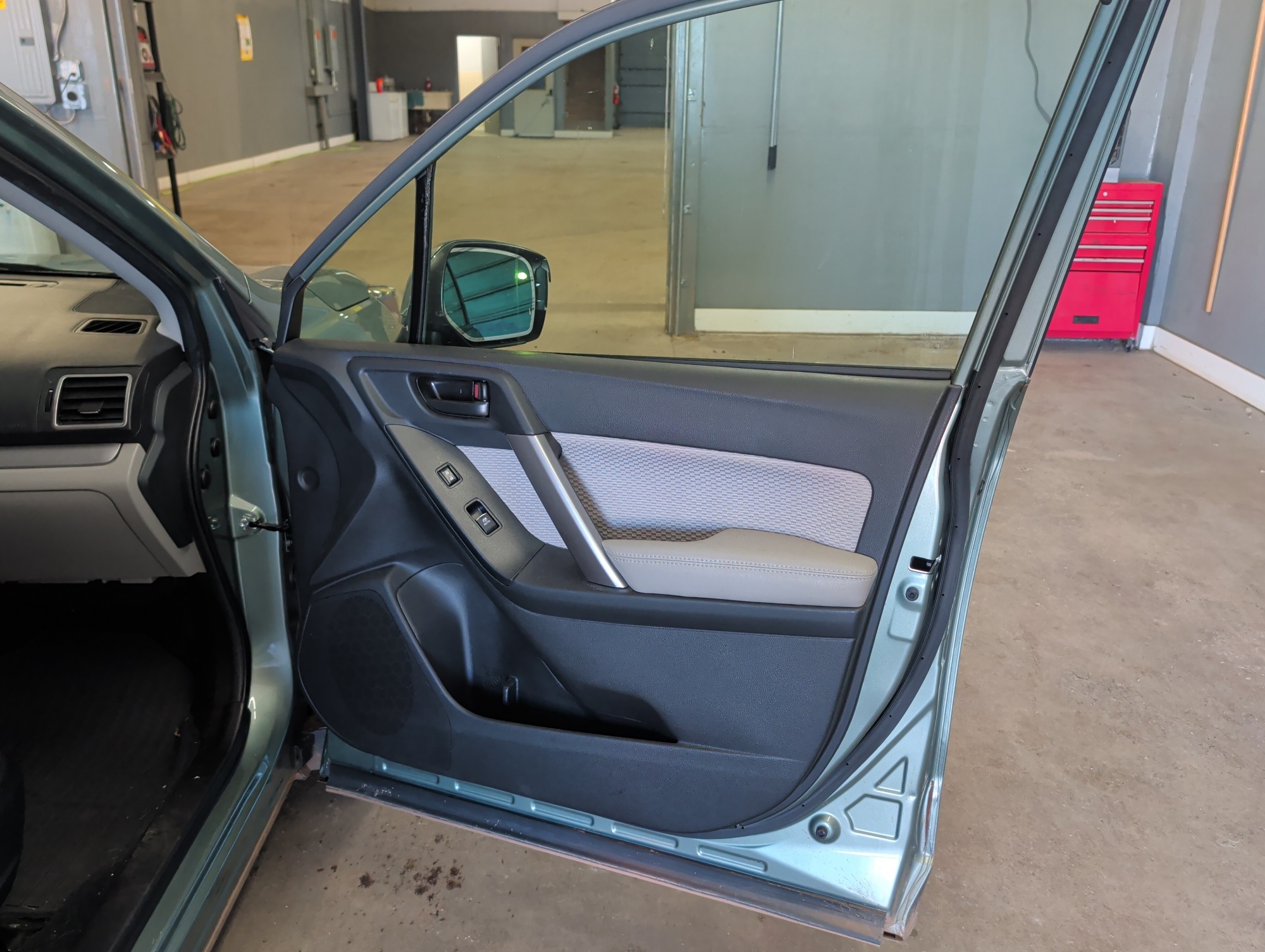 2017 subaru forester 2.5i-premium-pzev-cvt with 119029 miles for sale near elk-river, minnesota 106413_32_passenger_door_panel.jpg