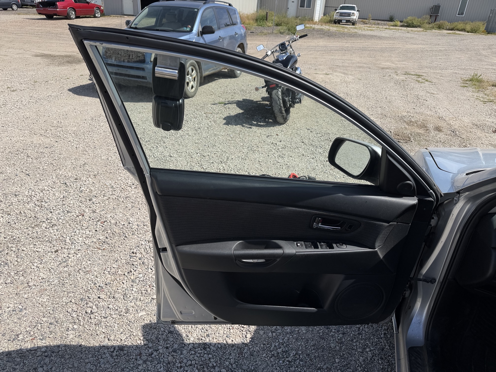 2008 mazda mazda3 i-sport-4-door with 106057 miles for sale near elk-river, minnesota 106437_23_driver_door_panel.jpg