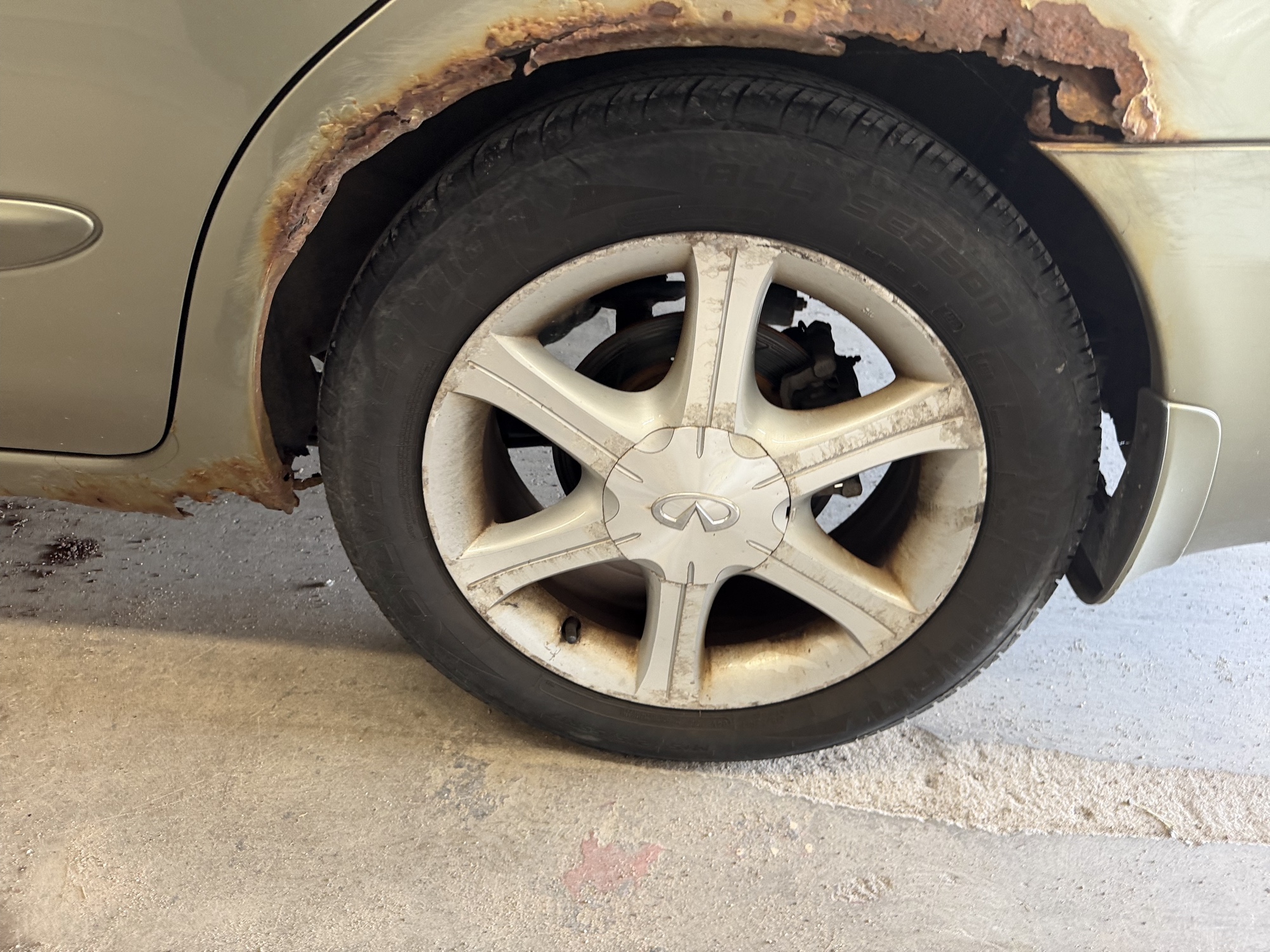 2003 infiniti i35 luxury with 176048 miles for sale near elk-river, minnesota 106442_13_rear_drv_wheel.jpg