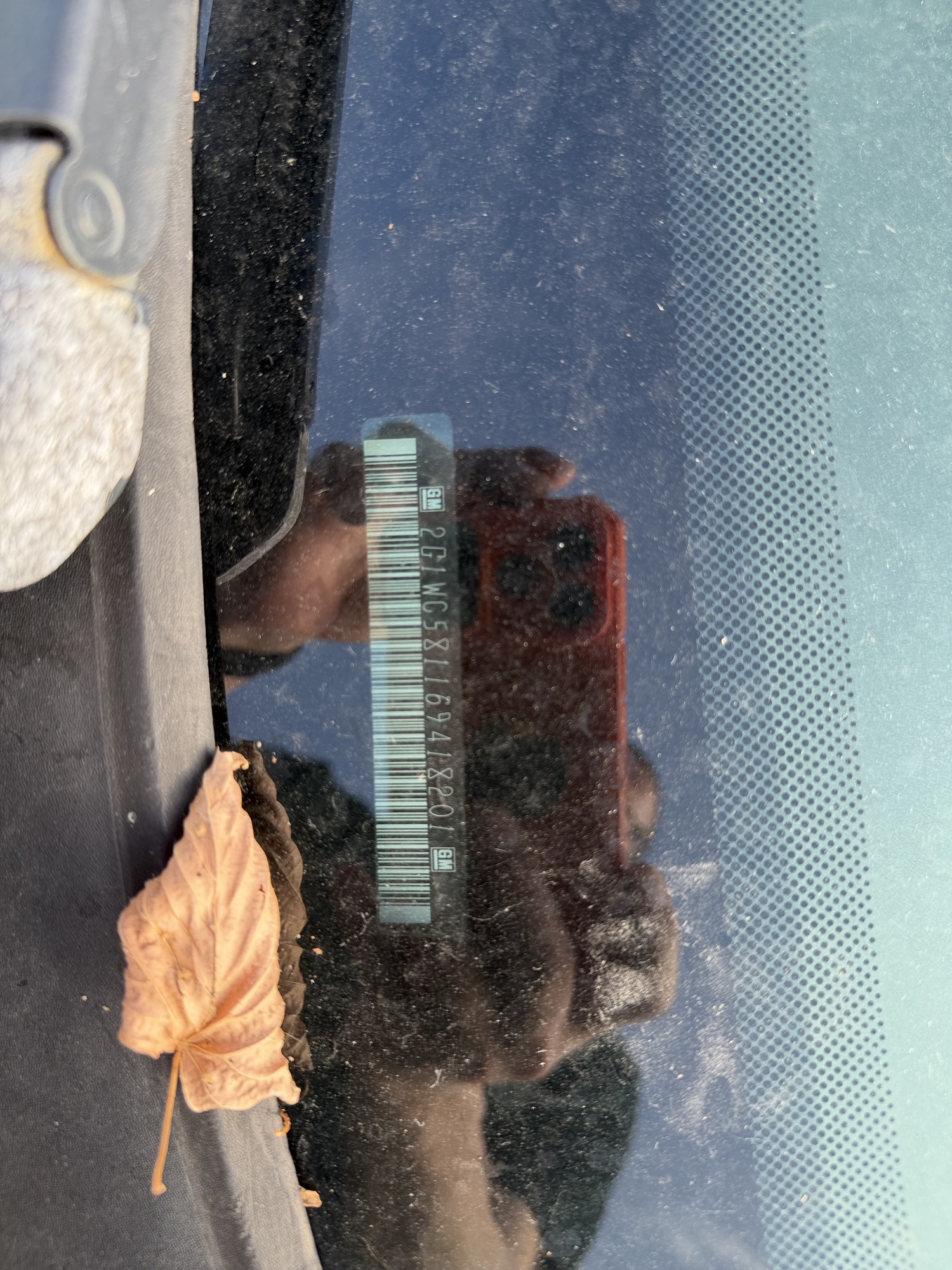 2006 chevrolet impala with 107595 miles for sale near elk-river, minnesota 106444_48_windshield_vin_plate.jpg