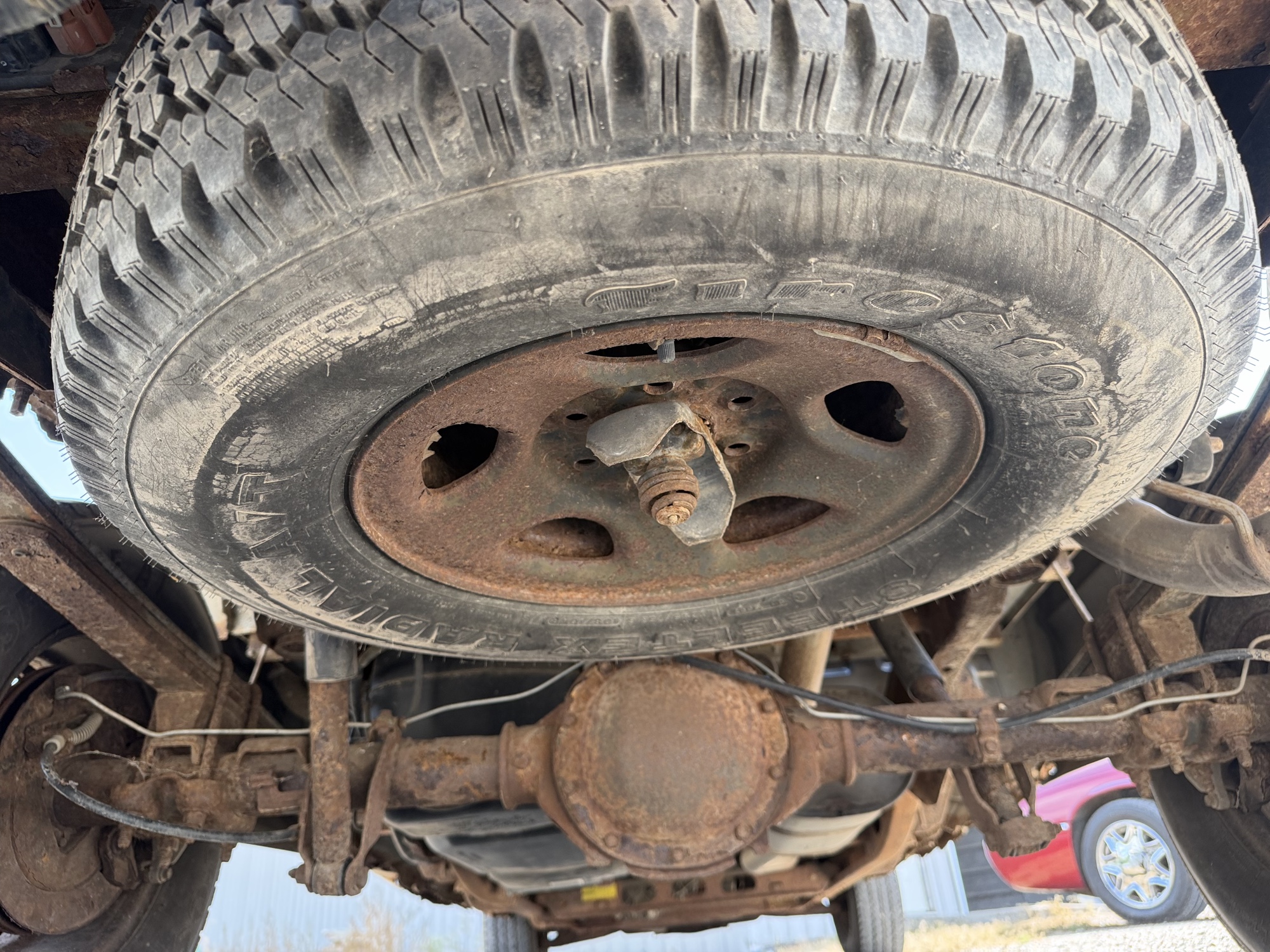 2003 chevrolet silverado-1500 ext.-cab-short-bed-4wd with 150423 miles for sale near elk-river, minnesota 106493_27_spare_tire.jpg