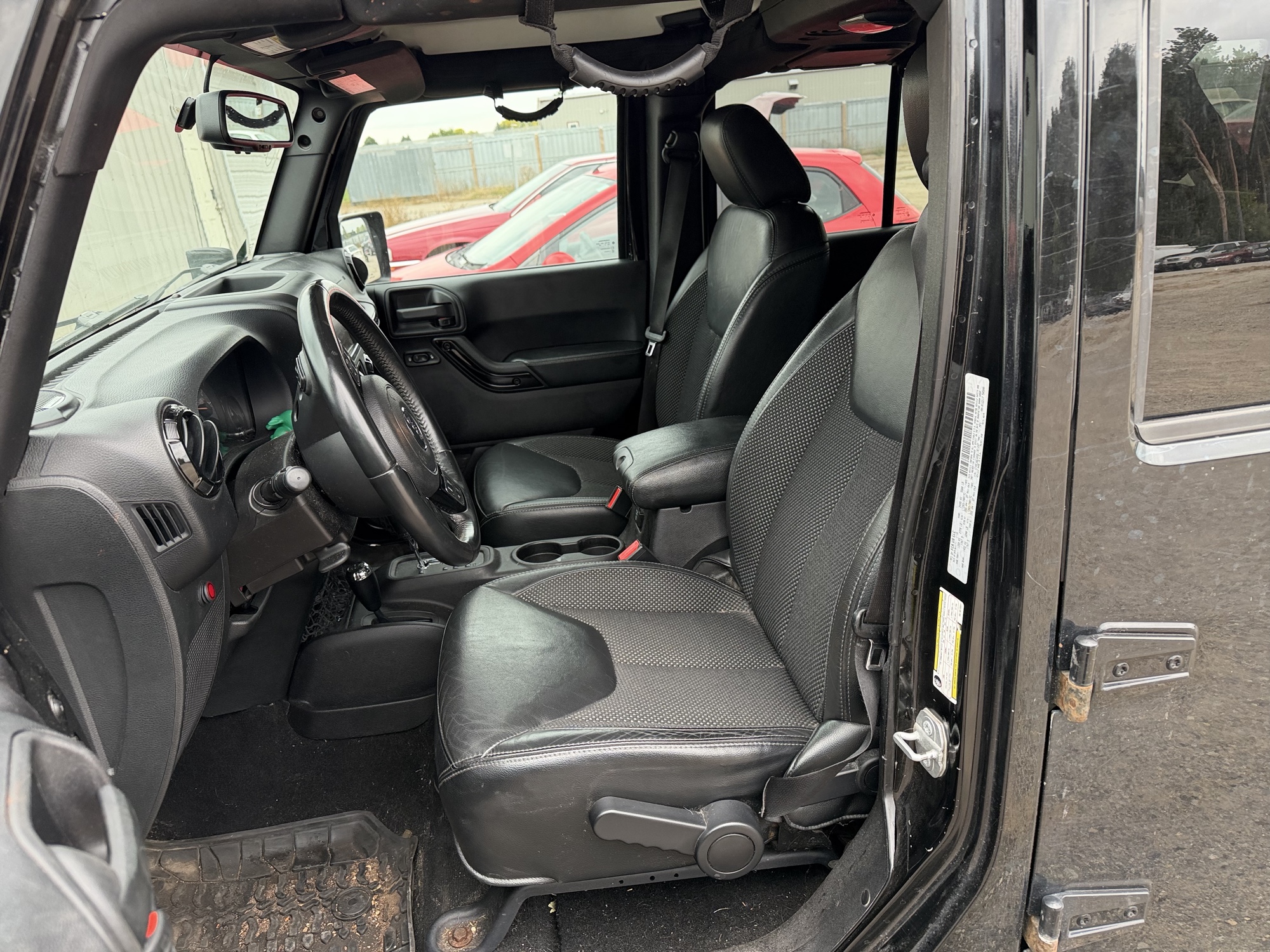 2016 jeep wrangler unlimited-sahara-4wd with 91724 miles for sale near Elk River, Minnesota 106578_22_driver_seat.jpg