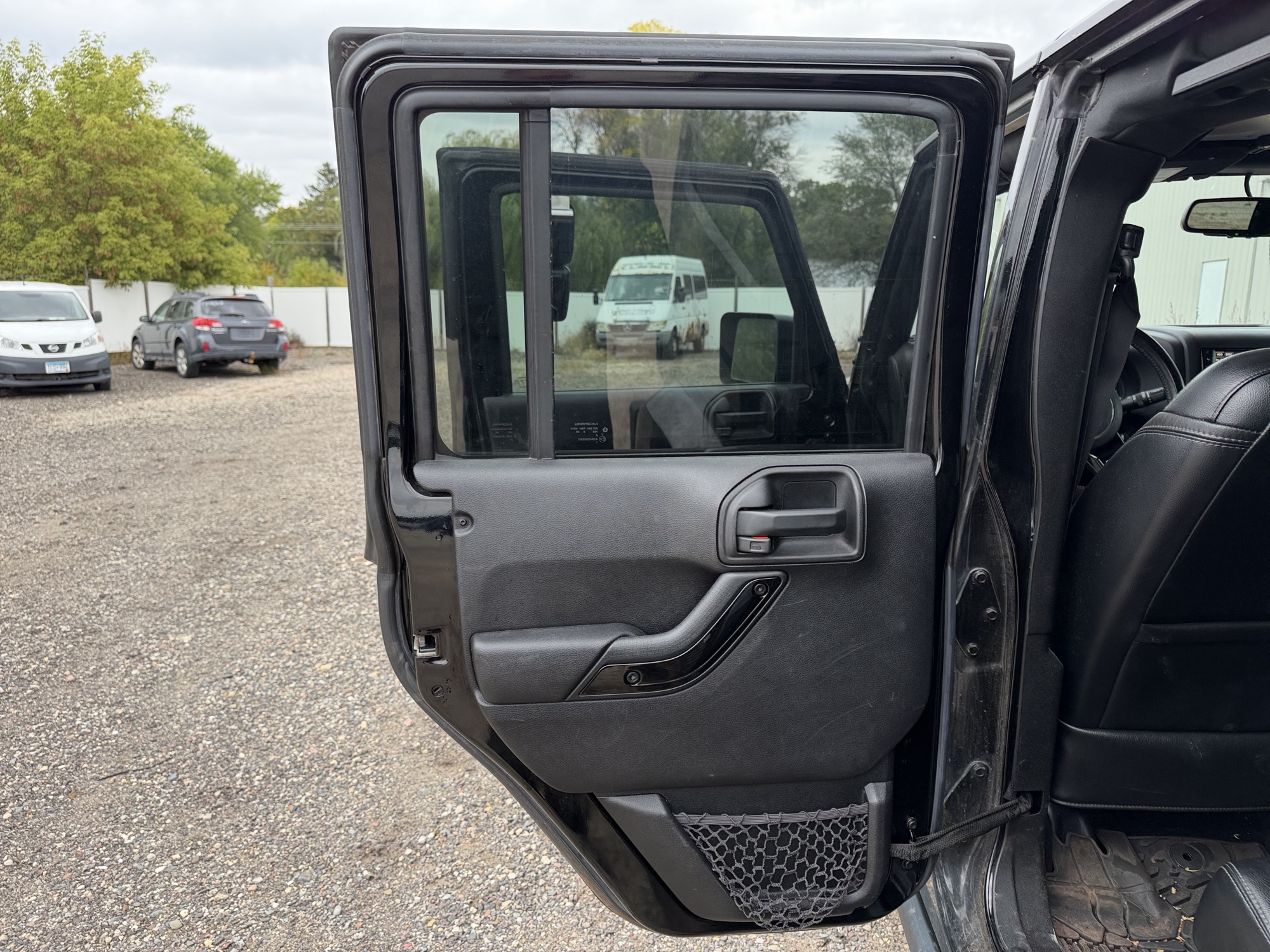 2016 jeep wrangler unlimited-sahara-4wd with 91724 miles for sale near Elk River, Minnesota 106578_25_drv_rear_door_panel.jpg