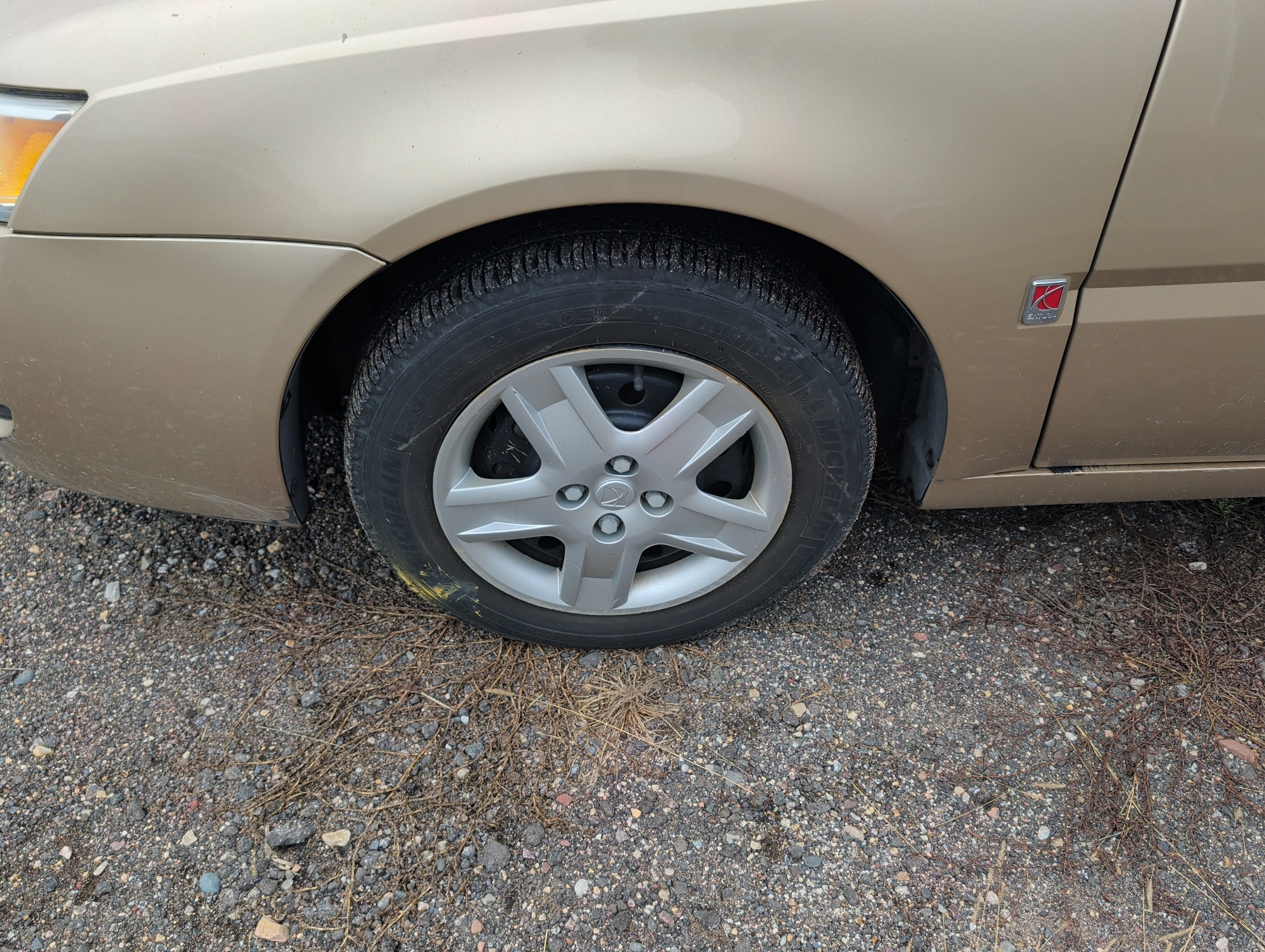 2006 saturn ion with 93338 miles for sale near Elk River, Minnesota 106579_12_drv_front_wheel.jpg