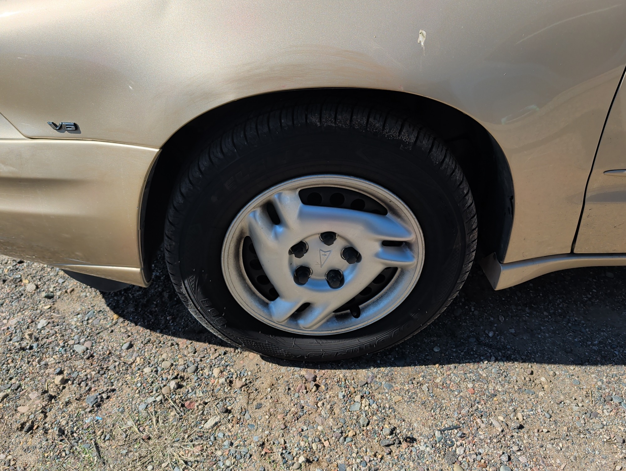 2004 pontiac grand-am se1-sedan with 91565 miles for sale near Elk River, Minnesota 106619_12_drv_front_wheel.jpg