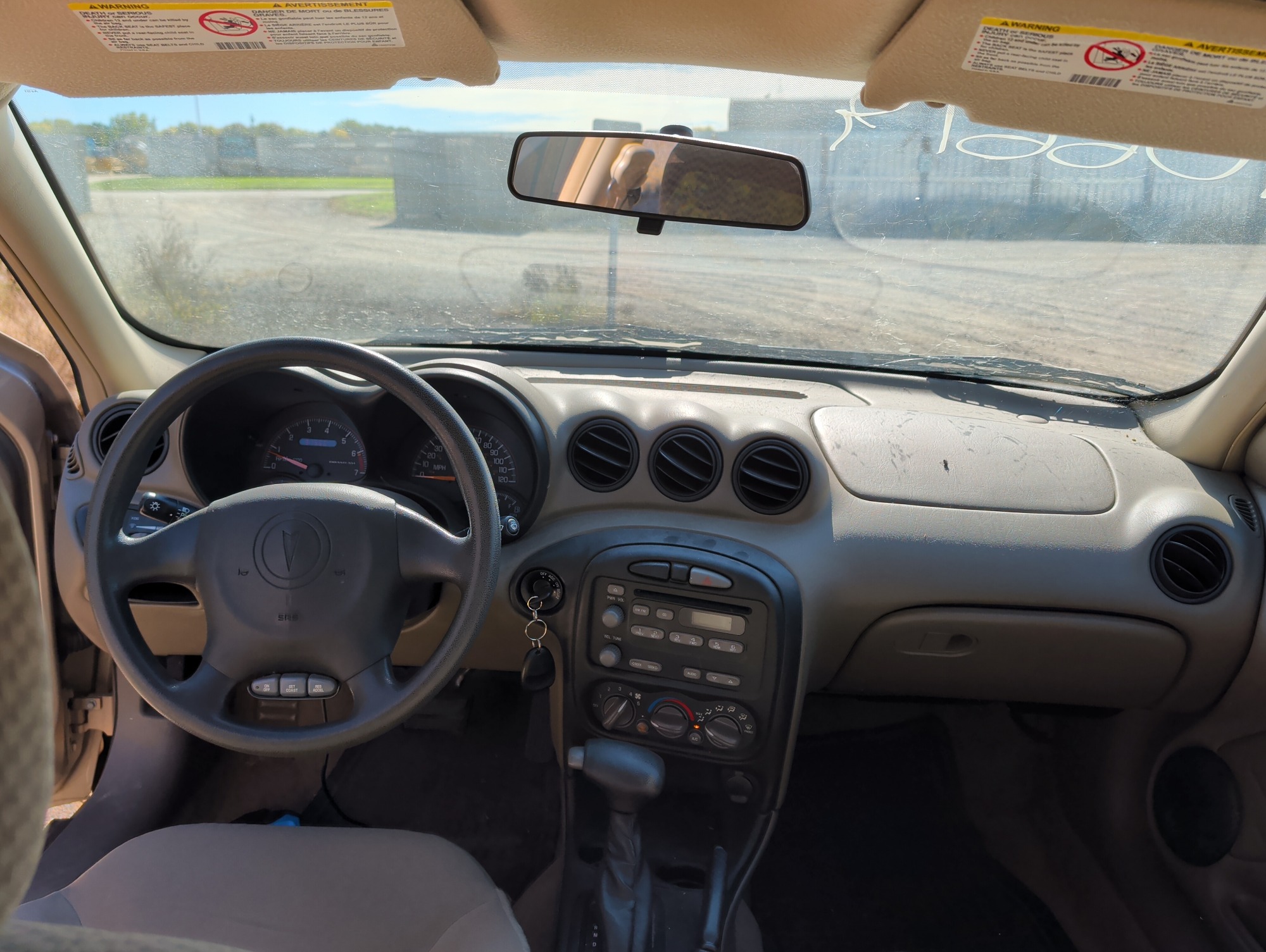 2004 pontiac grand-am se1-sedan with 91565 miles for sale near Elk River, Minnesota 106619_34_whole_dash.jpg