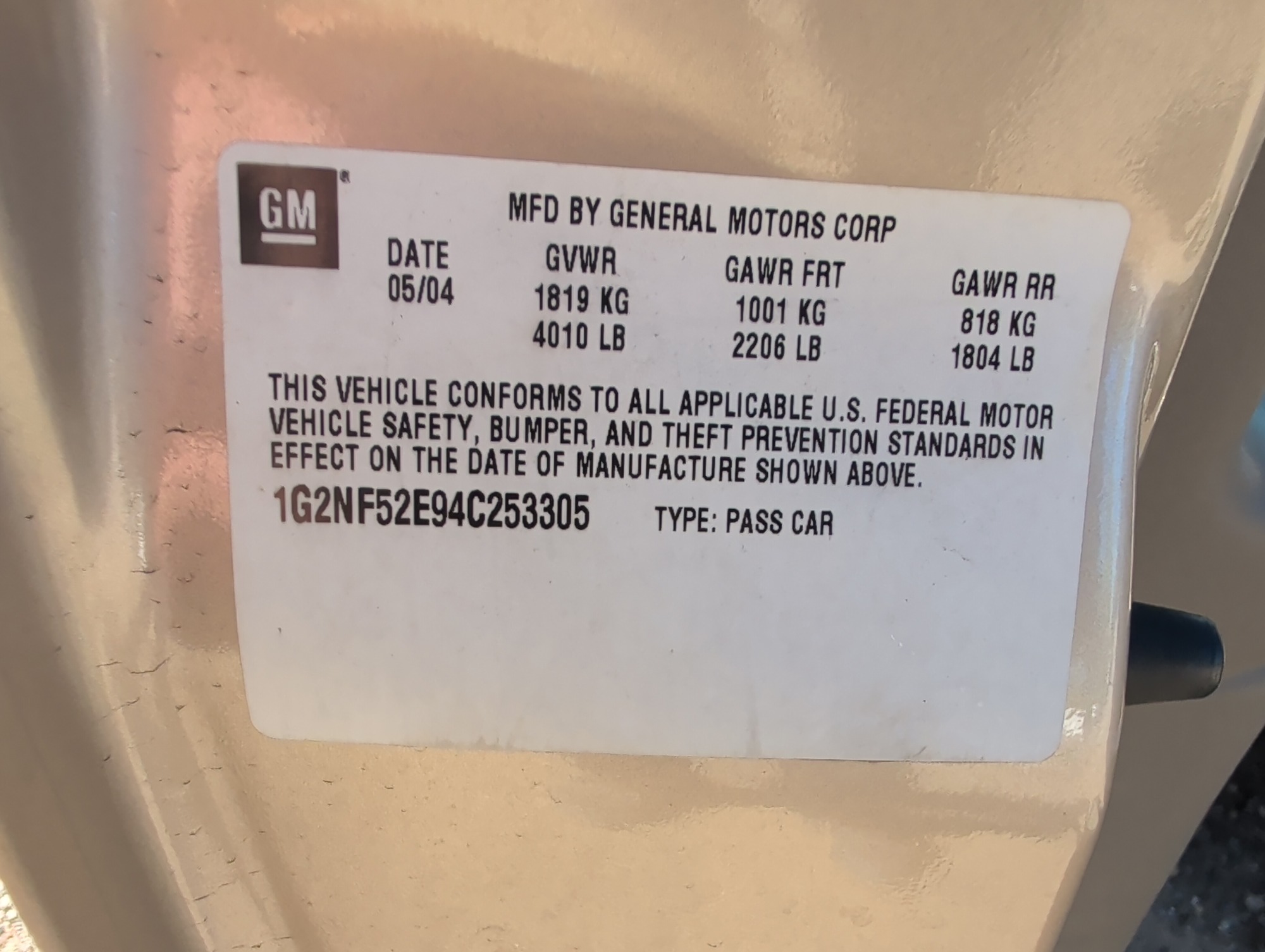 2004 pontiac grand-am se1-sedan with 91565 miles for sale near Elk River, Minnesota 106619_47_door_vin_sticker.jpg