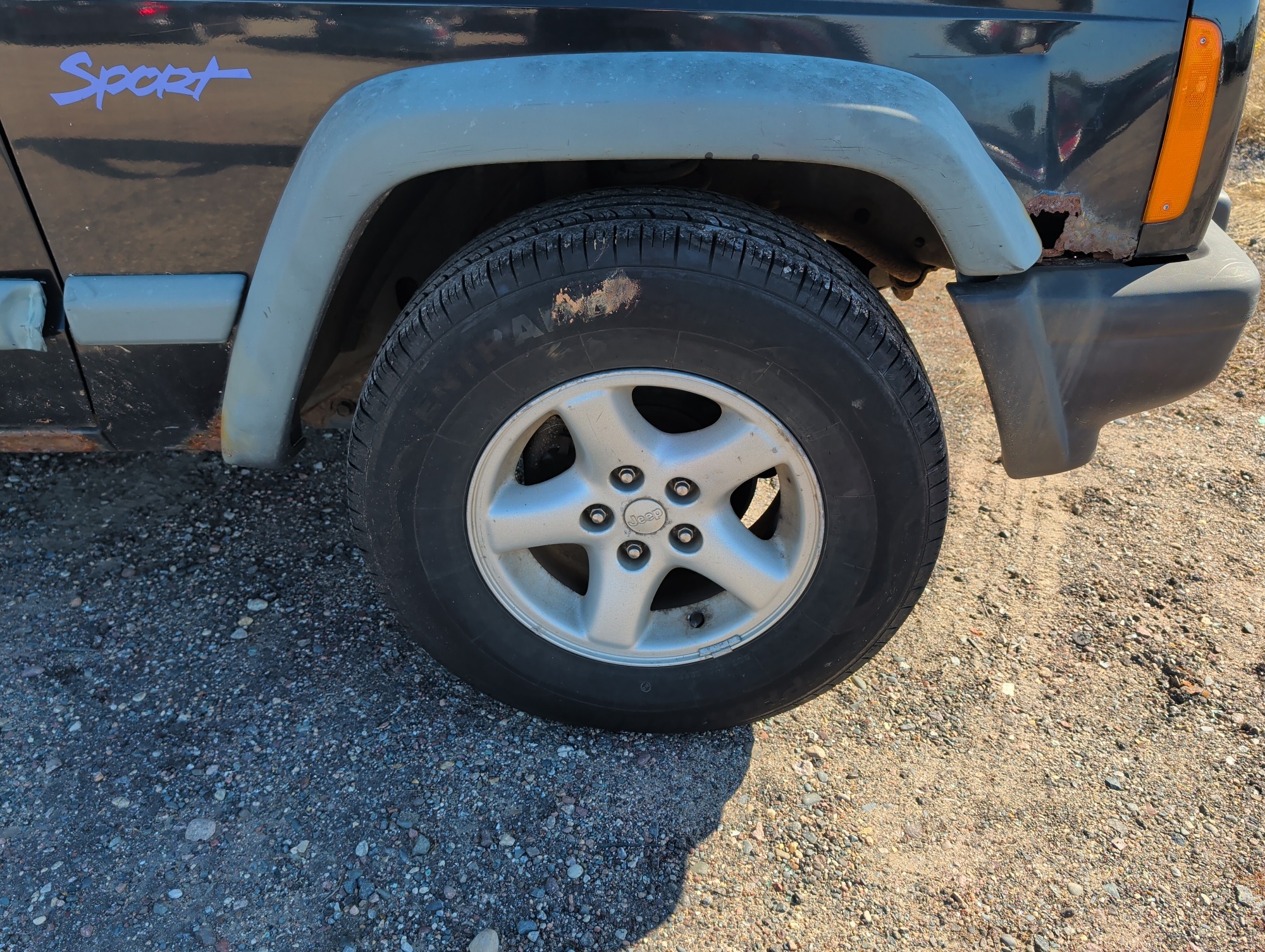 1998 jeep cherokee sport-4-door-4wd with 185611 miles for sale near Elk River, Minnesota 106637_15_front_pass_wheel.jpg