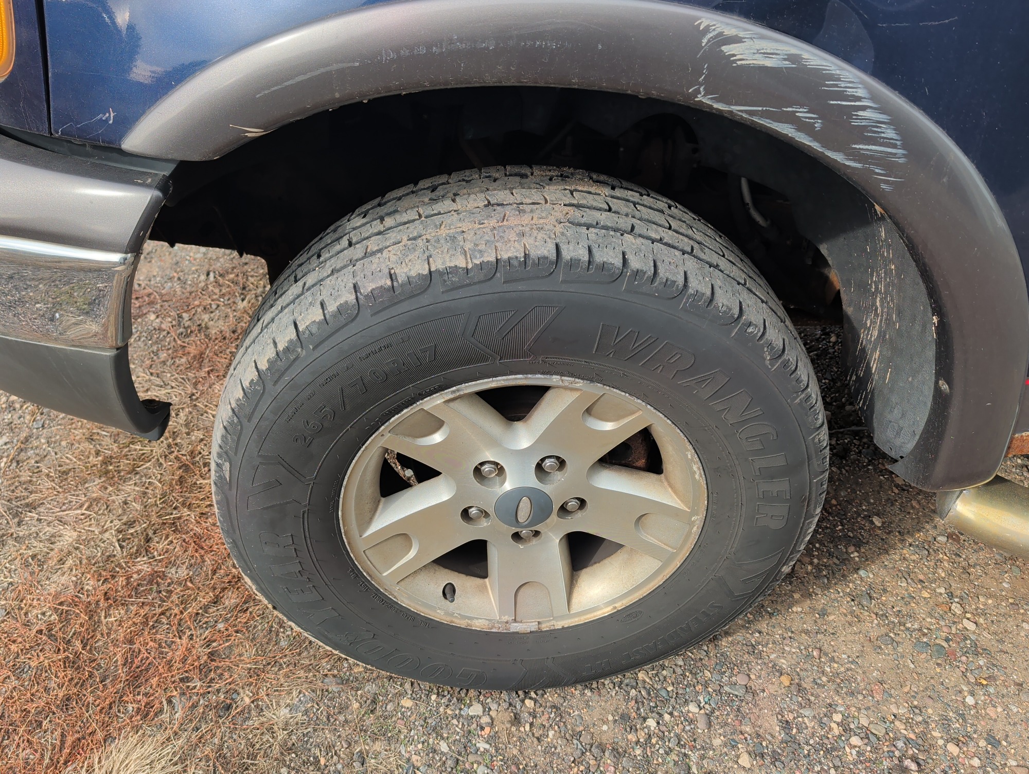 2002 ford f-150 xlt-supercrew-short-bed-4wd with 370405 miles for sale near Elk River, Minnesota 106651_12_drv_front_wheel.jpg