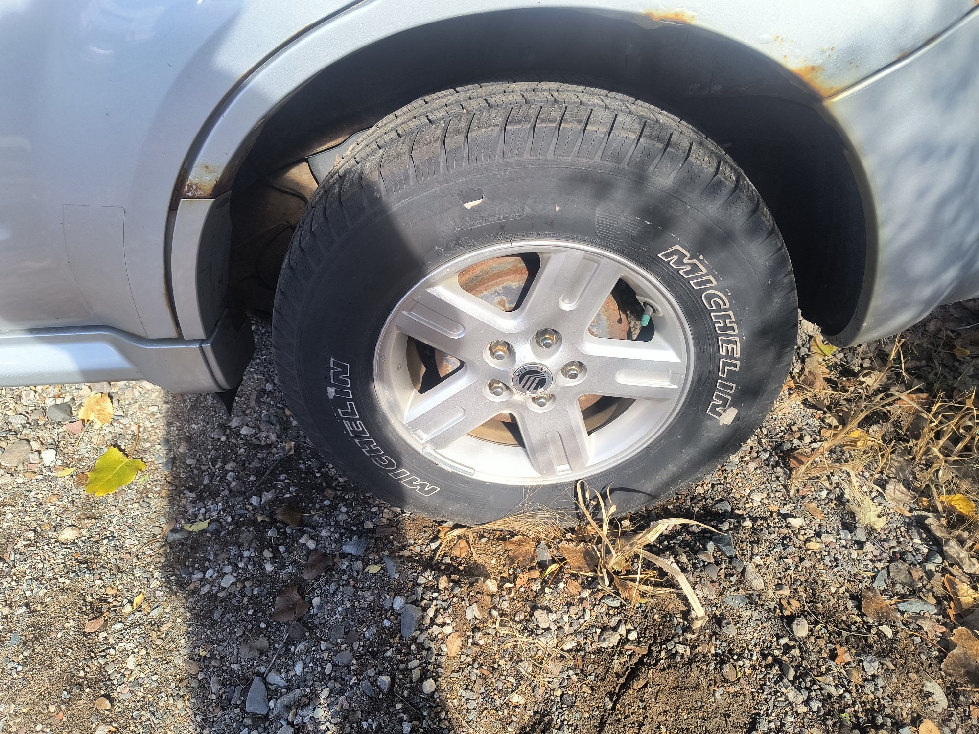 2009 mercury mariner-hybrid 4wd with 333358 miles for sale near Elk River, Minnesota 106658_13_rear_drv_wheel.jpg