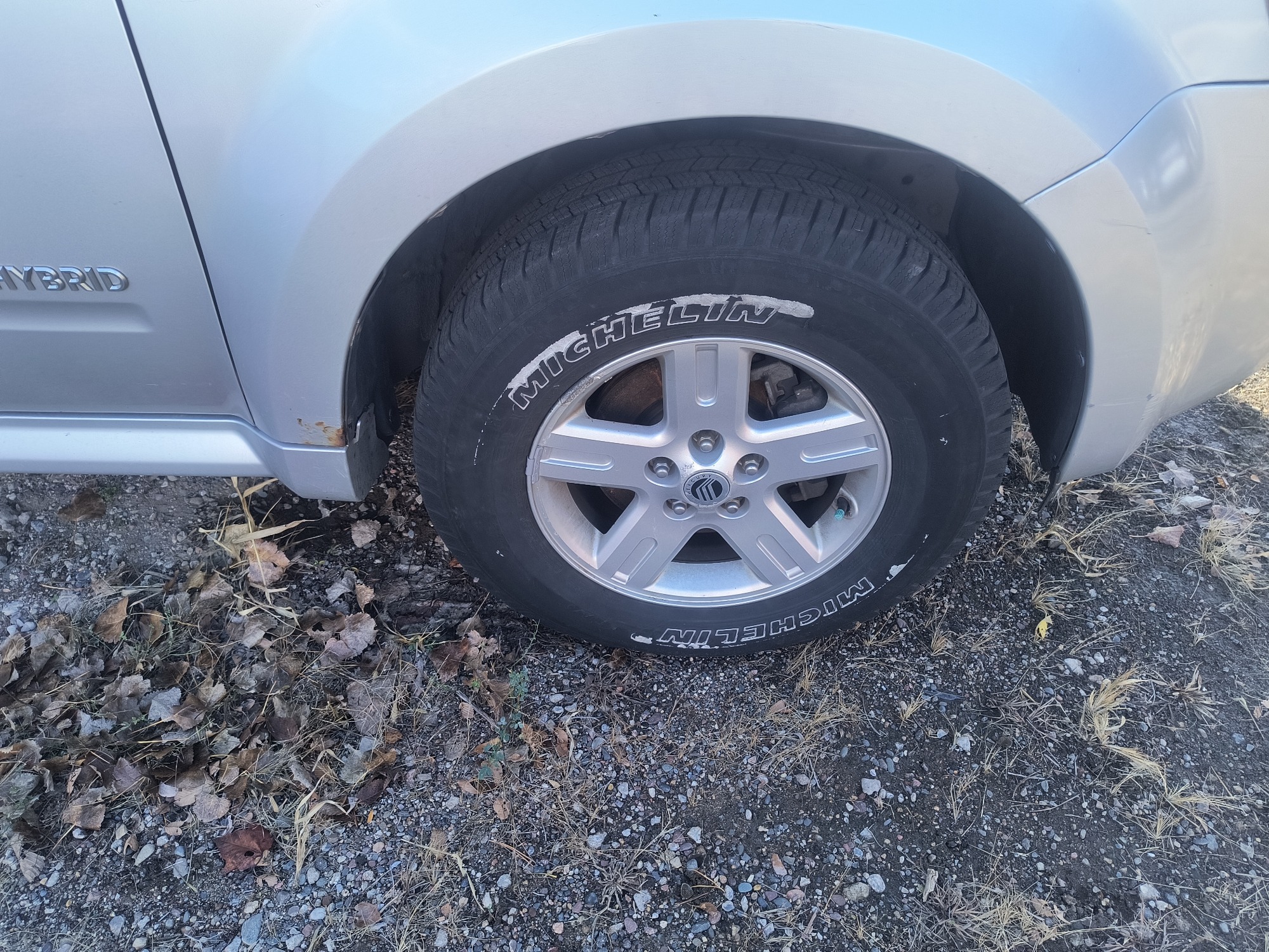 2009 mercury mariner-hybrid 4wd with 333358 miles for sale near Elk River, Minnesota 106658_15_front_pass_wheel.jpg