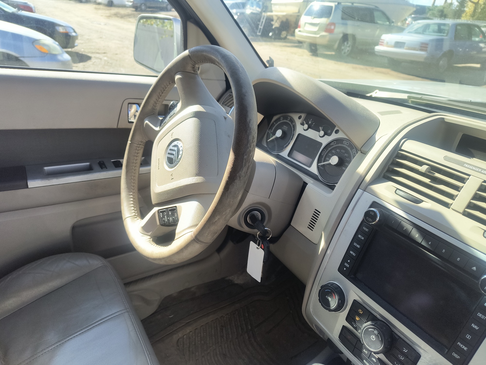 2009 mercury mariner-hybrid 4wd with 333358 miles for sale near Elk River, Minnesota 106658_36_steering_wheel.jpg