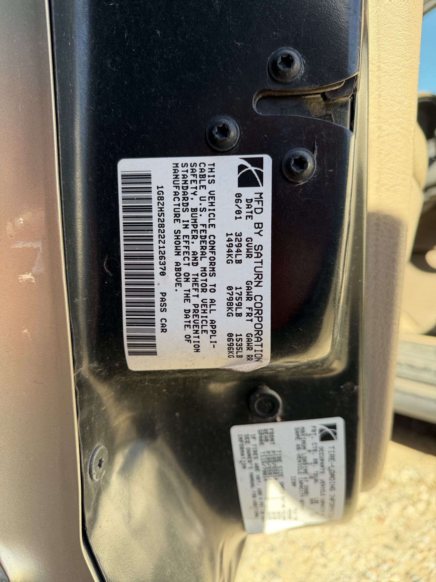 2002 saturn sl sl1 with 170974 miles for sale near Elk River, Minnesota 106660_47_door_vin_sticker.jpg