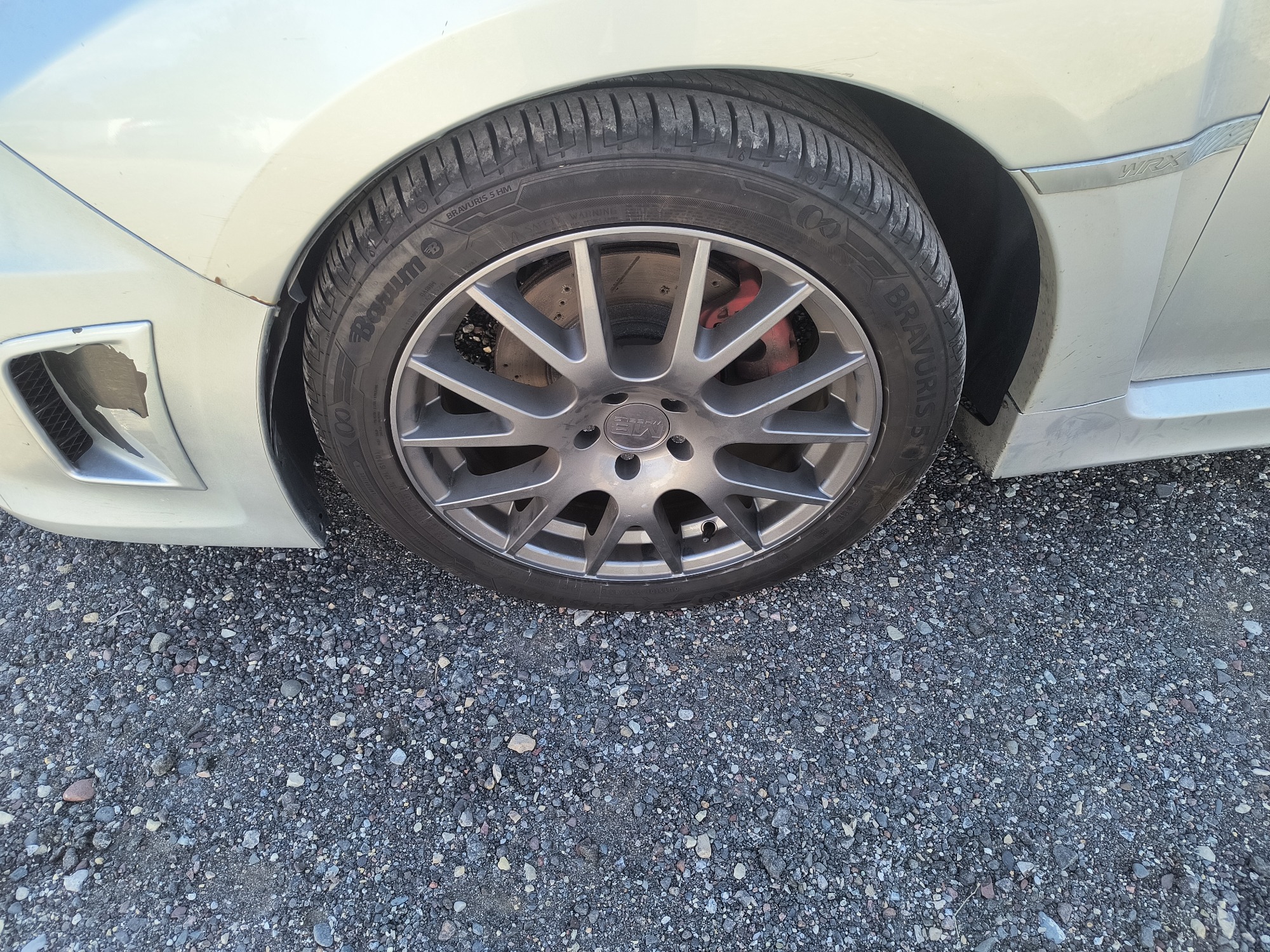 2011 subaru impreza-wrx 4-door with 128706 miles for sale near Elk River, Minnesota 106706_12_drv_front_wheel.jpg