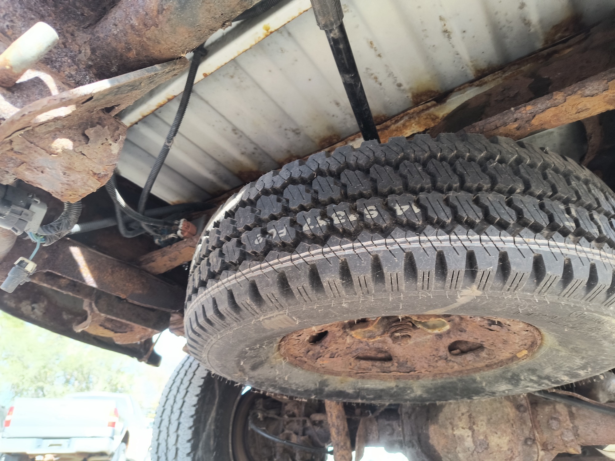 2003 chevrolet silverado-2500hd 4wd with 76253 miles for sale near Elk River, Minnesota 106720_27_spare_tire.jpg