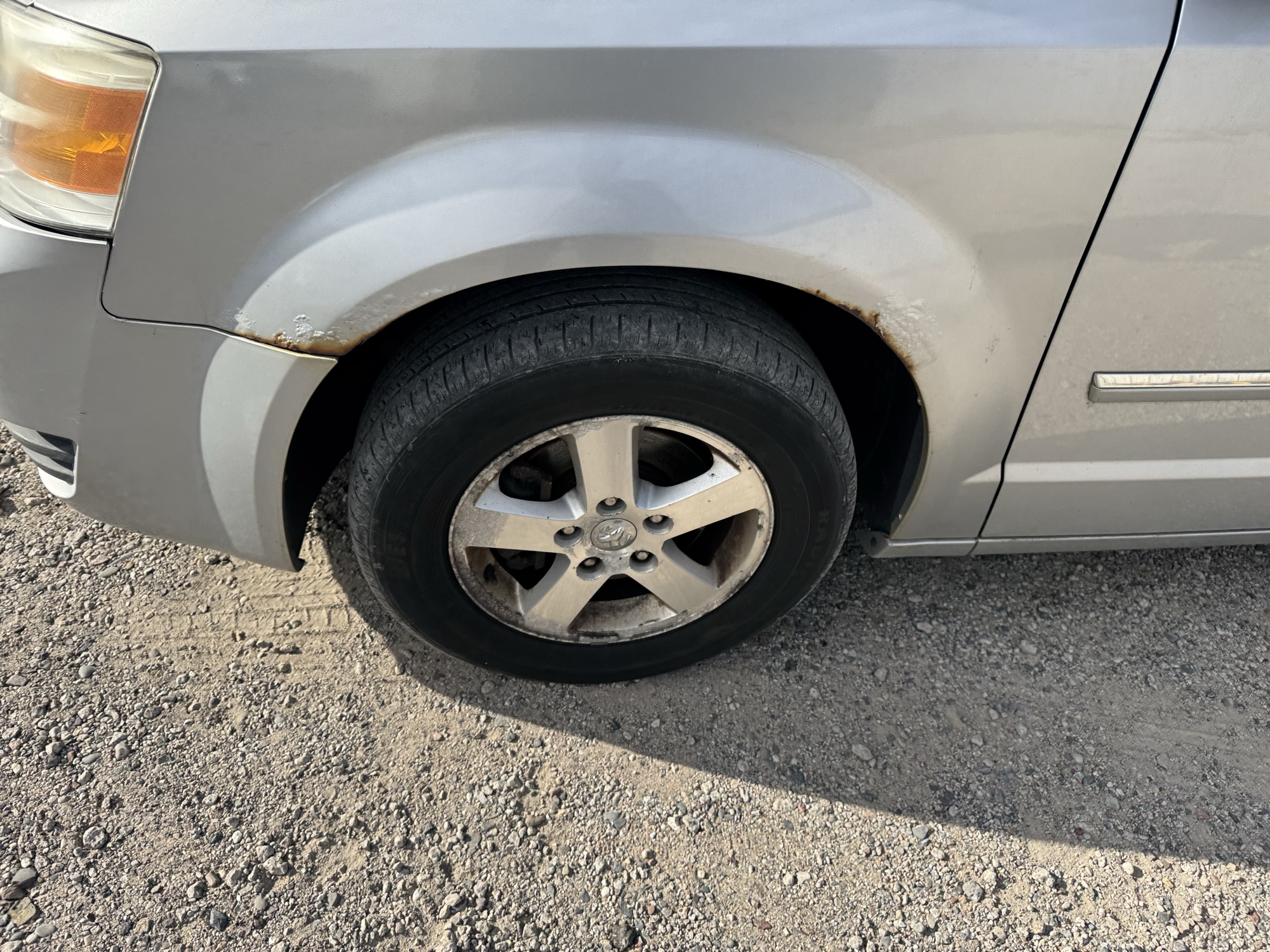 2009 dodge grand-caravan sxt with 228009 miles for sale near Elk River, Minnesota 106901_12_drv_front_wheel.jpg