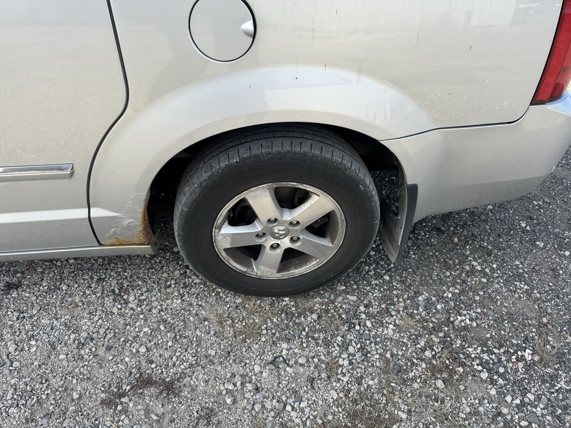 2009 dodge grand-caravan sxt with 228009 miles for sale near Elk River, Minnesota 106901_13_rear_drv_wheel.jpg