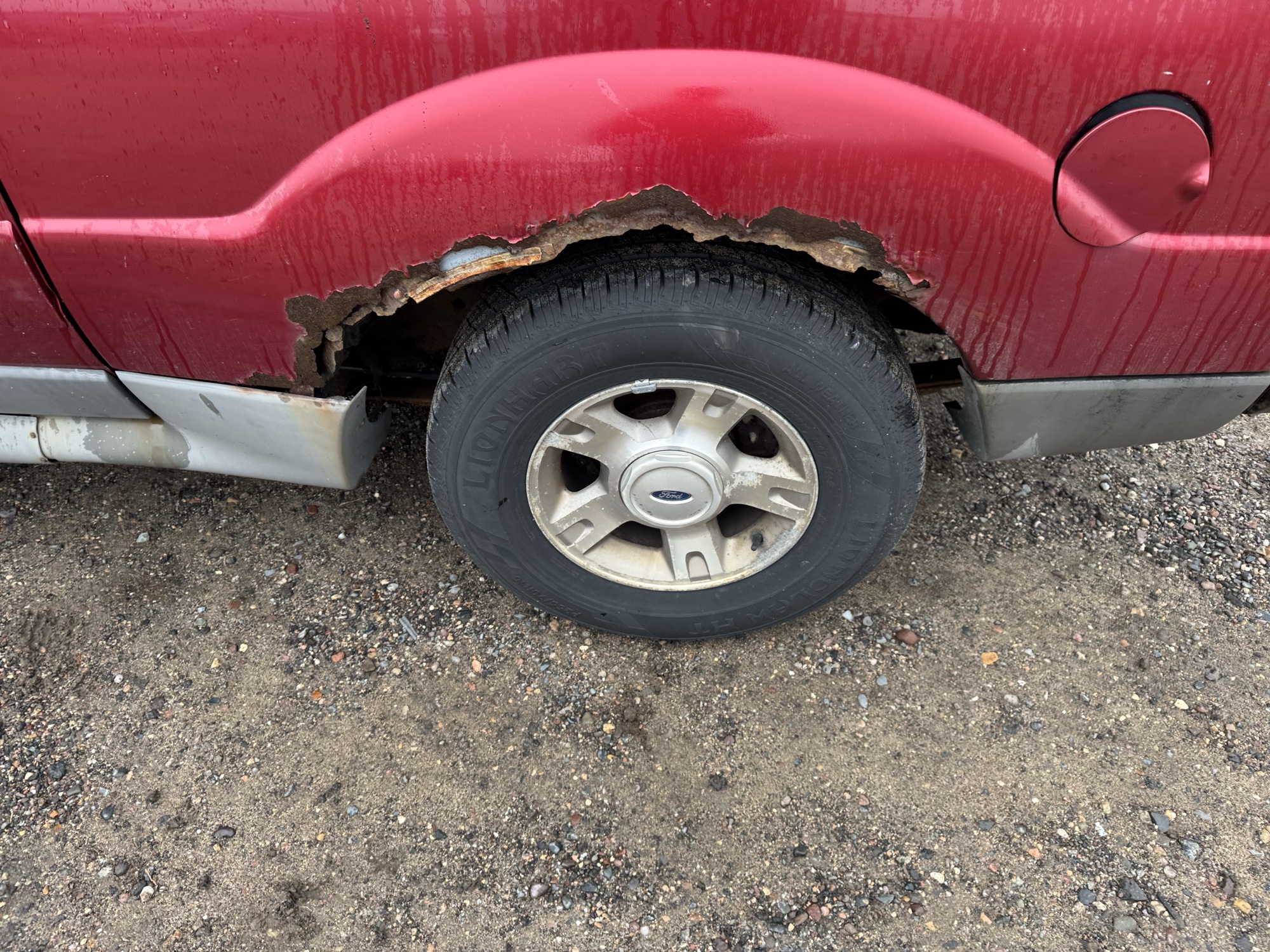 2003 ford explorer-sport xls-4wd with 199208 miles for sale near Elk River, Minnesota 106932_13_rear_drv_wheel.jpg