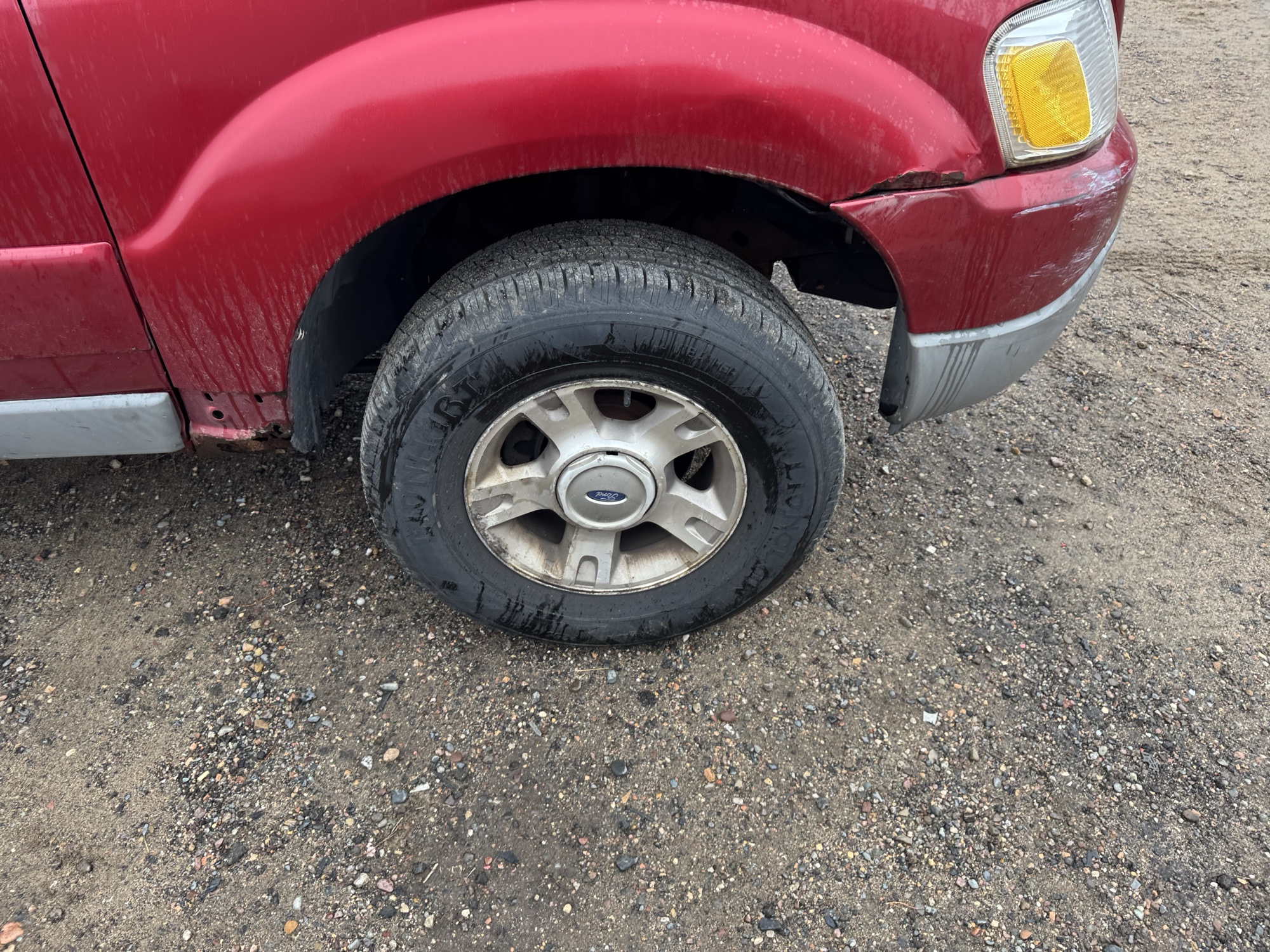 2003 ford explorer-sport xls-4wd with 199208 miles for sale near Elk River, Minnesota 106932_15_front_pass_wheel.jpg