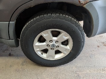 2005 ford escape xlt-4wd with 137067 miles for sale near elk-river, minnesota 106306_13_rear_drv_wheel.jpg