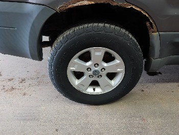 2005 ford escape xlt-4wd with 137067 miles for sale near elk-river, minnesota 106306_14_rear_pass_wheel.jpg