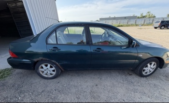 2002 mitsubishi lancer base with 166691 miles for sale near elk-river, minnesota 106319_06_pass_side.jpg