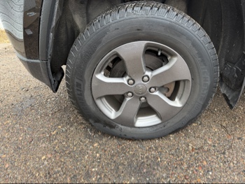 2013 jeep grand-cherokee laredo-4wd with 134157 miles for sale near elk-river, minnesota 106371_12_drv_front_wheel.jpg