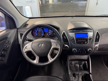 2010 hyundai tucson limited-2wd with 229317 miles for sale near elk-river, minnesota 106392_33_dash_from_driver.jpg