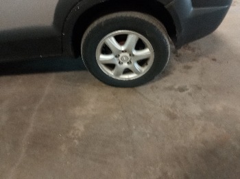 2005 hyundai tucson gls-2.7-4wd with 199158 miles for sale near elk-river, minnesota 106395_13_rear_drv_wheel.jpg