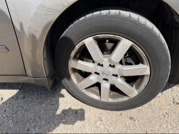 2006 nissan maxima se with 134407 miles for sale near elk-river, minnesota 106396_15_front_pass_wheel.jpg