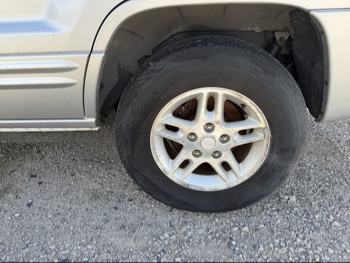2004 jeep grand-cherokee laredo-2wd with 138807 miles for sale near elk-river, minnesota 106397_13_rear_drv_wheel.jpg